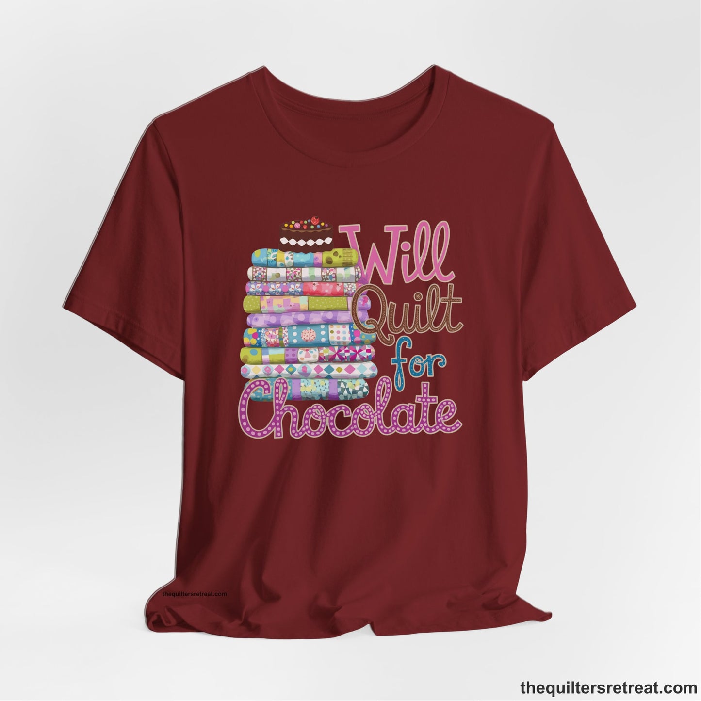 A Cardinal Short Sleeve T-Shirt with a stack of colorful quilts topped with cake, whimsical "Will Quilt for Chocolate" text