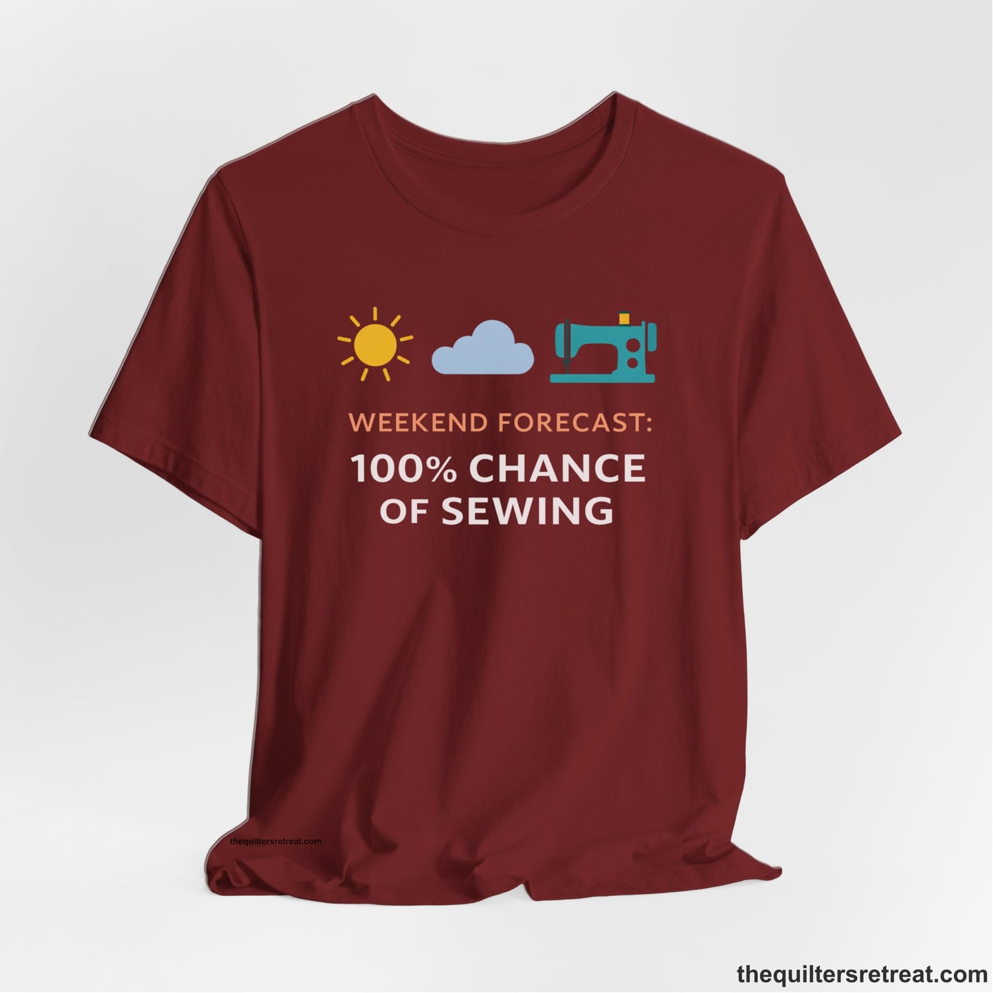A Cardinal Short Sleeve T-Shirt with a Sun, cloud, sewing machine icons; bold text "Weekend Forecast: 100% Chance of Sewing"; playful style.