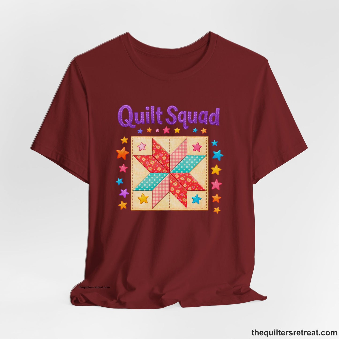 A Cardinal Short Sleeve T-Shirt with a Patchwork quilt star with colorful stars, playful mood, "Quilt Squad" text.