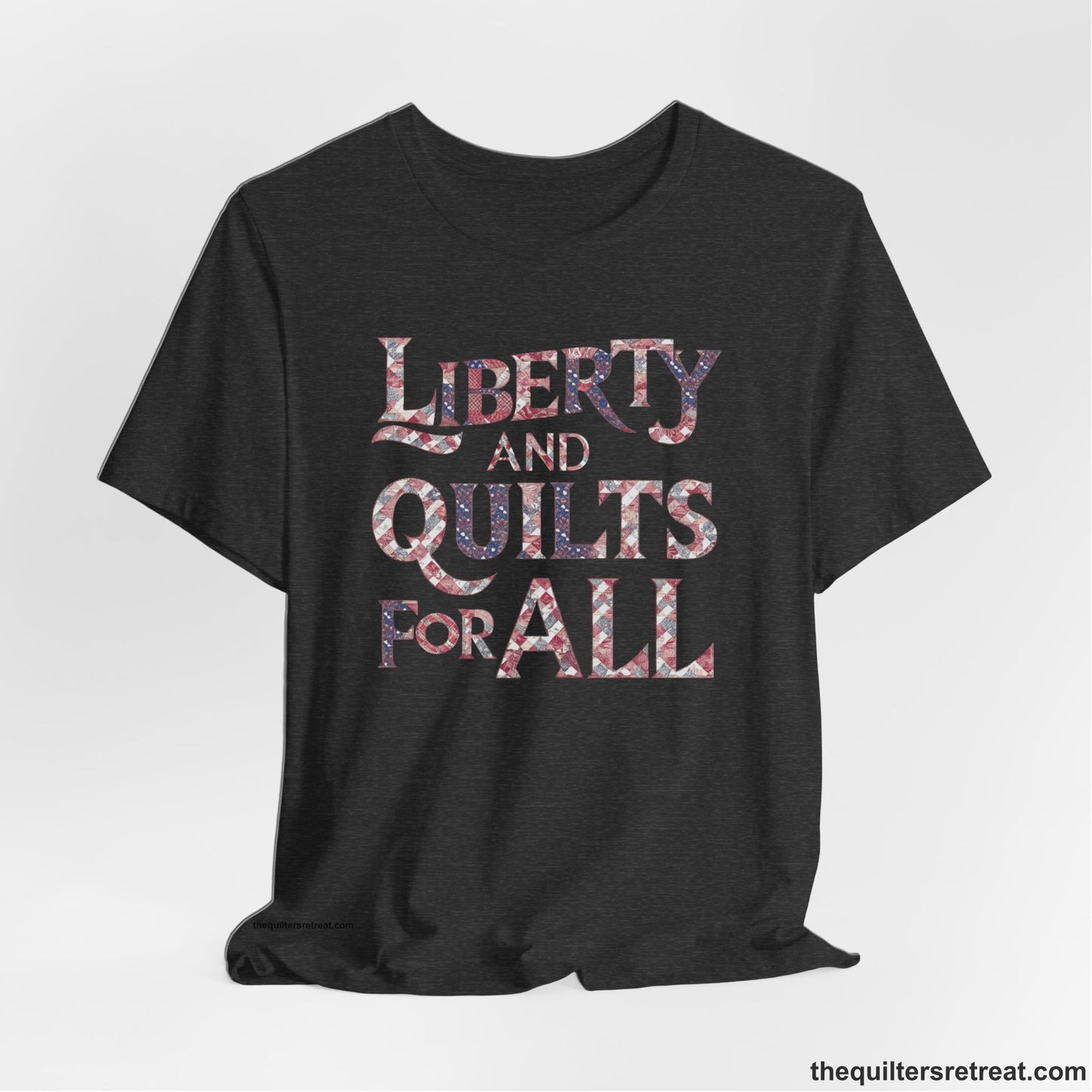A Dark Grey Heather Short Sleeve T-Shirt with a Liberty and Quilts for All" text with patchwork quilt pattern in a vintage style