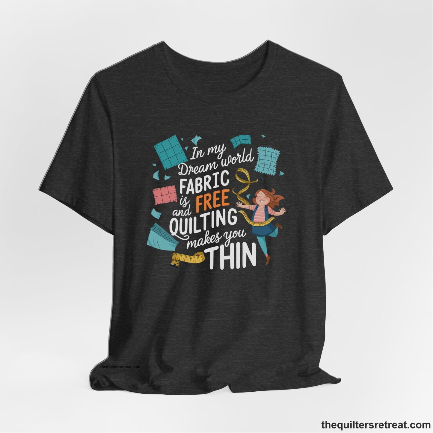 A Dark Grey Heather Short Sleeve T-Shirt with a inspirational quilting text with playful seamstress and colorful fabric scraps in whimsical style