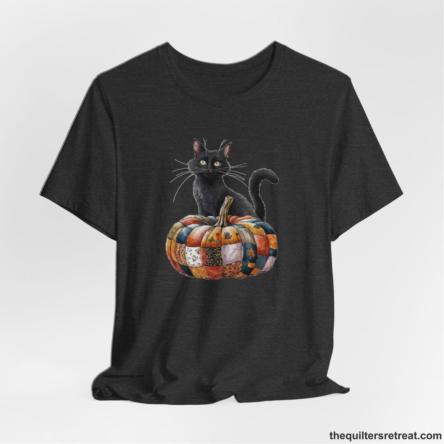 A Dark Grey Heather Short Sleeve T-Shirt with a black cat with a quilted patchwork pumpkin in a whimsical autumn style