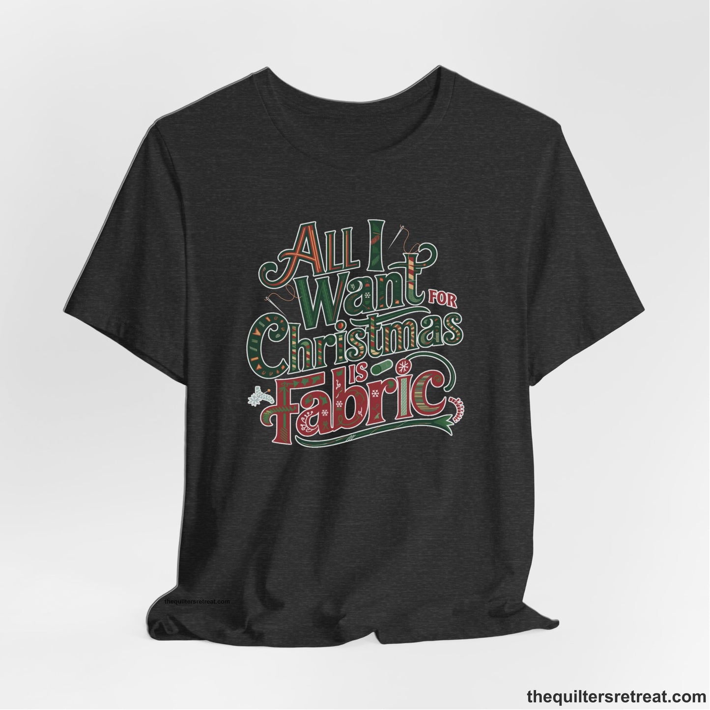 A Dark Grey Heather Short Sleeve T-Shirt with a vintage holiday text "All I Want for Christmas is Fabric" with festive motifs