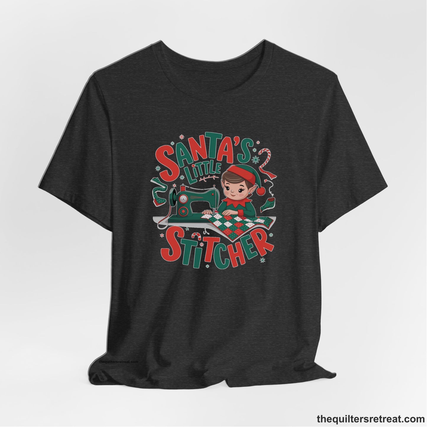 A Dark Grey Heather Short Sleeve T-Shirt with a santa's little stitcher elf sewing quilt with festive colors in playful style