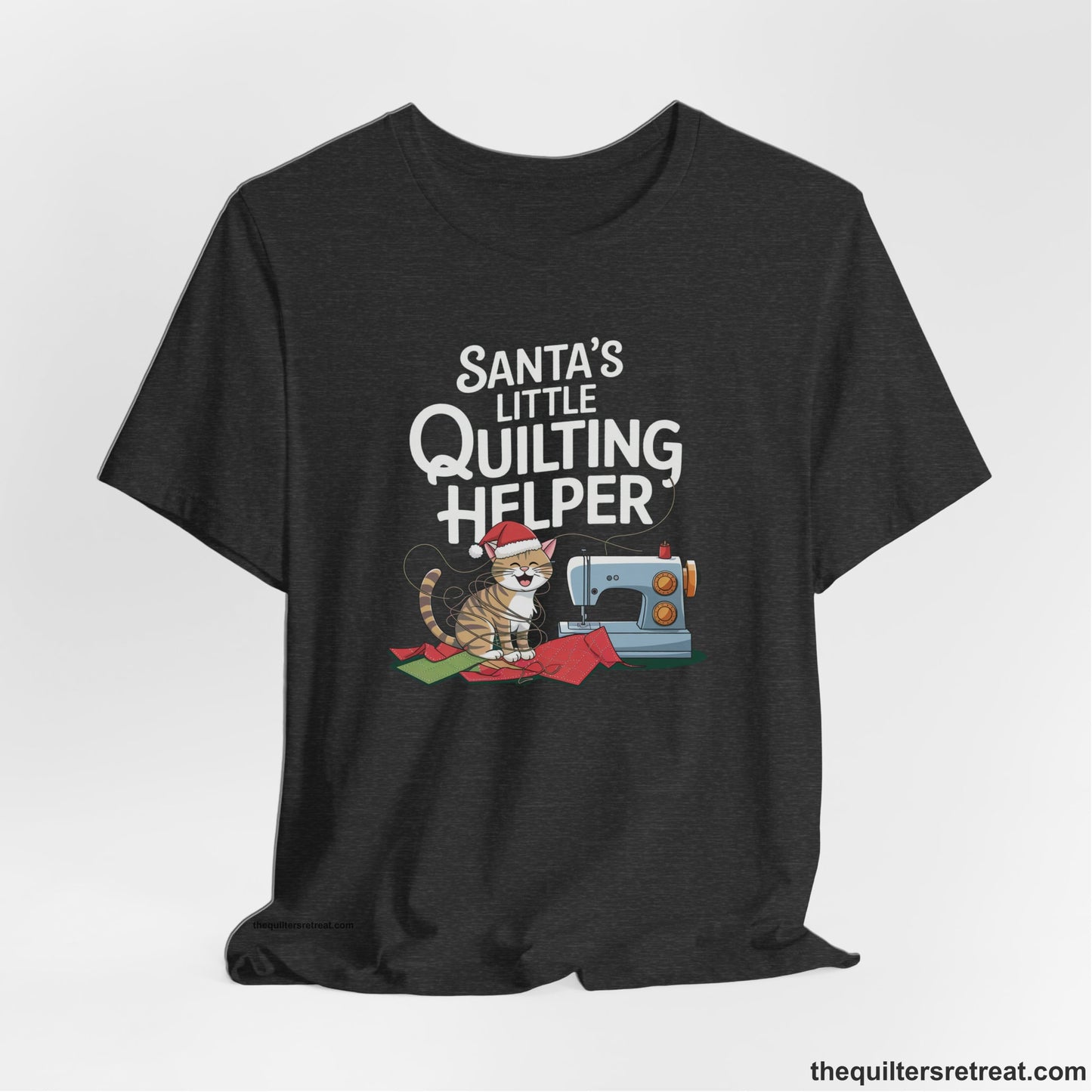 A Dark Grey Heather Short Sleeve T-Shirt with a santa-hat-wearing kitten with a sewing machine and "Santa's Little Quilting Helper" text in playful style