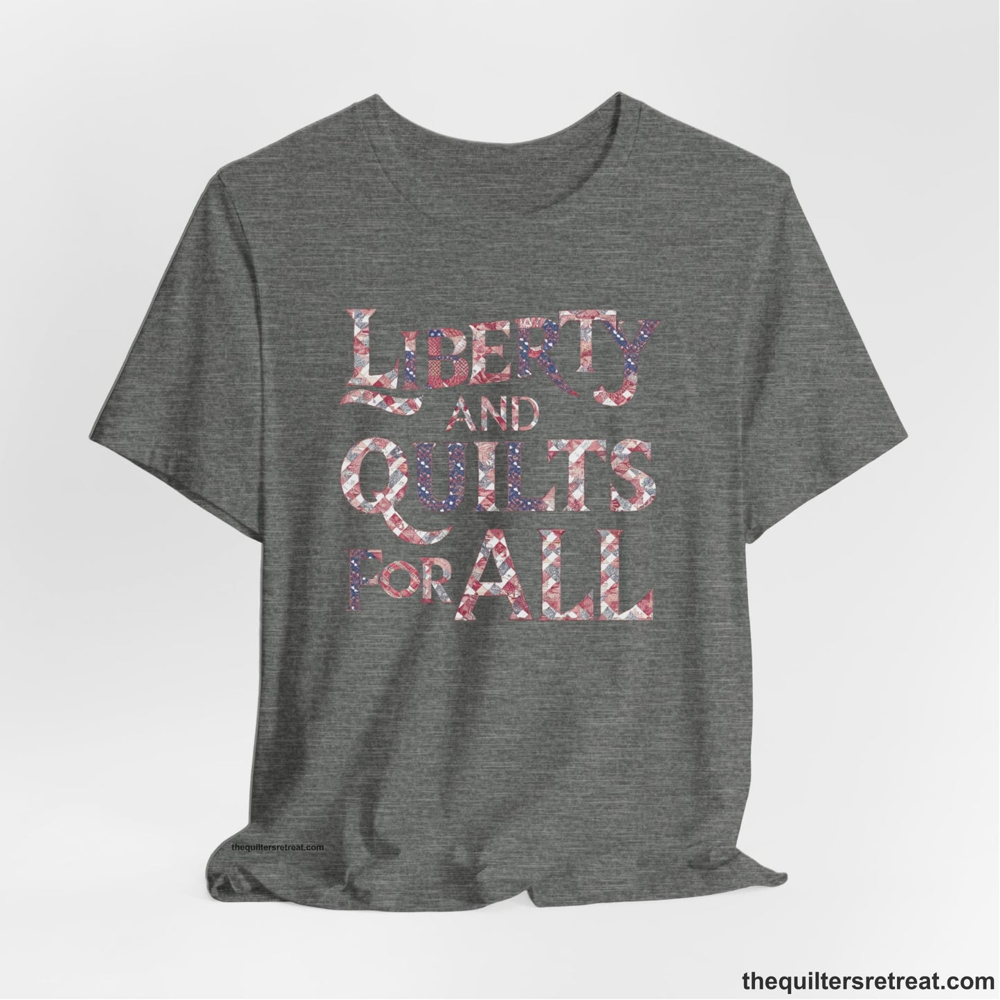 A Deep Heather Short Sleeve T-Shirt with a Liberty and Quilts for All" text with patchwork quilt pattern in a vintage style