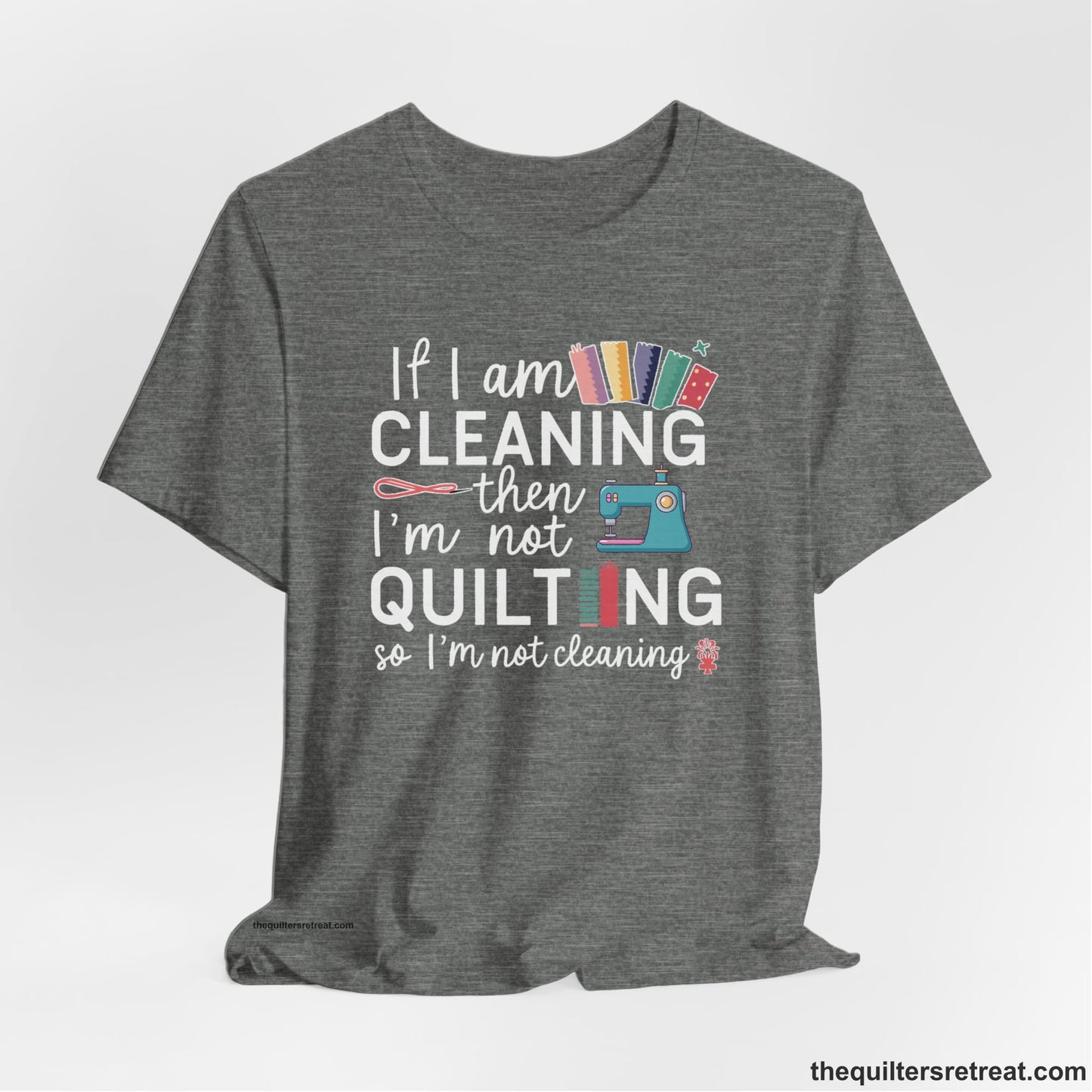 A Deep Heather Short Sleeve T-Shirt with a If I am cleaning then I'm not quilting text with sewing machine and fabric graphics