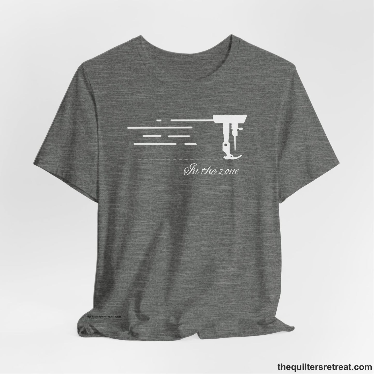 A Deep Heather Short Sleeve T-Shirt with a vintage sewing machine illustration with floral accents and "Sewing Mends the Soul" text