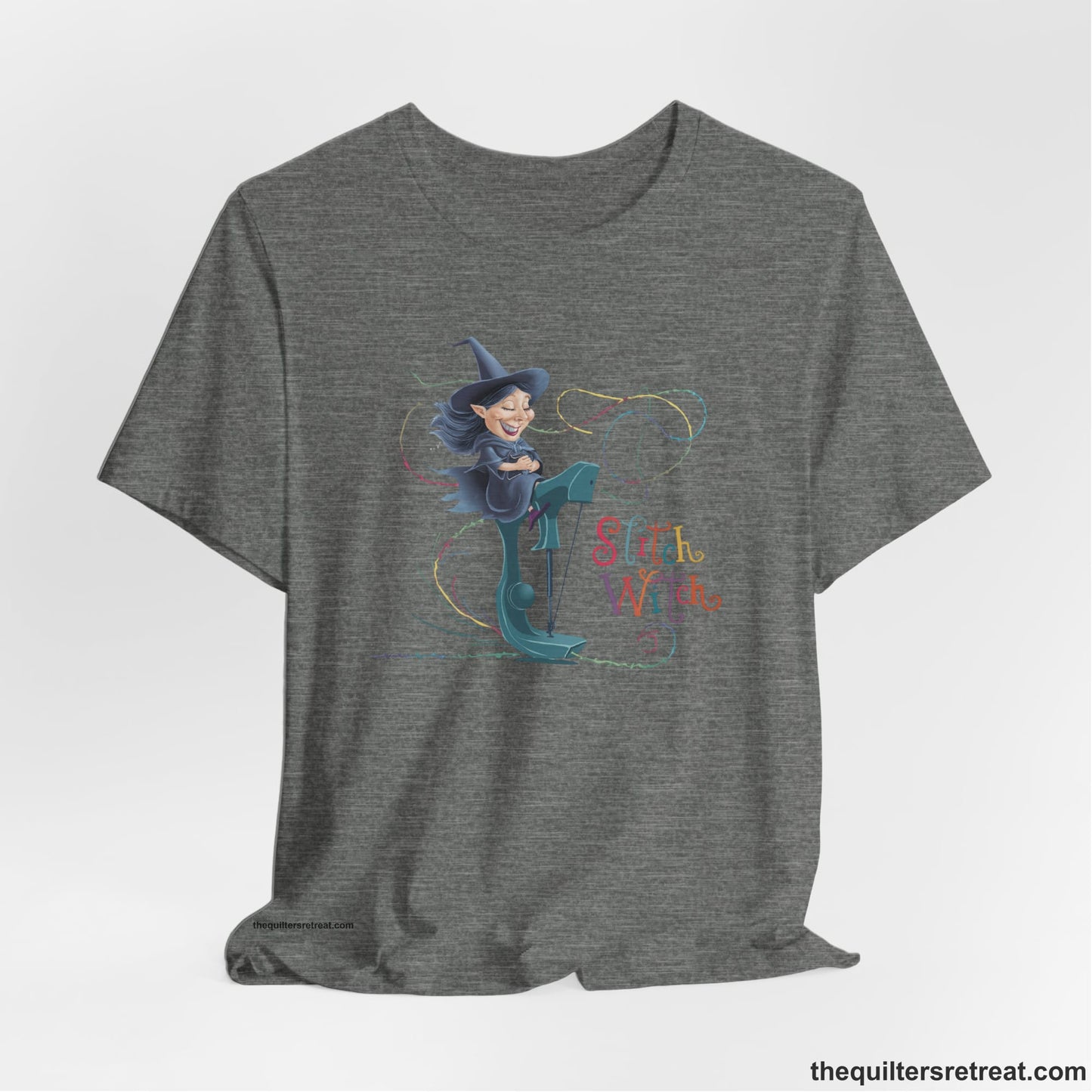 A Deep Heather Short Sleeve T-Shirt with a witch on vintage sewing machine with "Stitch Witch" text in playful, colorful style