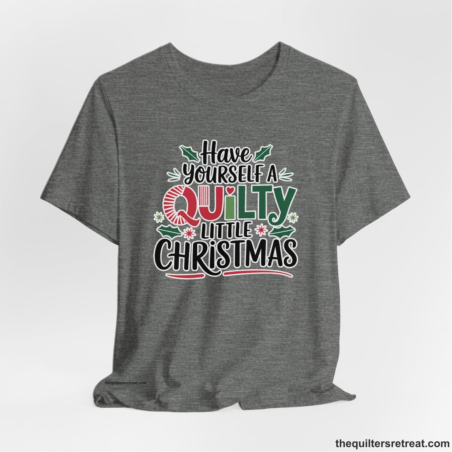 A Deep Heather Short Sleeve T-Shirt with a festive "Have Yourself a Quilty Little Christmas" text with holly and quilt patterns