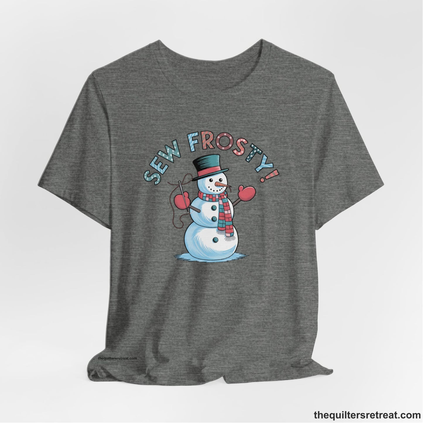 A Deep Heather Short Sleeve T-Shirt with a playful snowman sewing illustration with "Sew Frosty!" text in a festive style