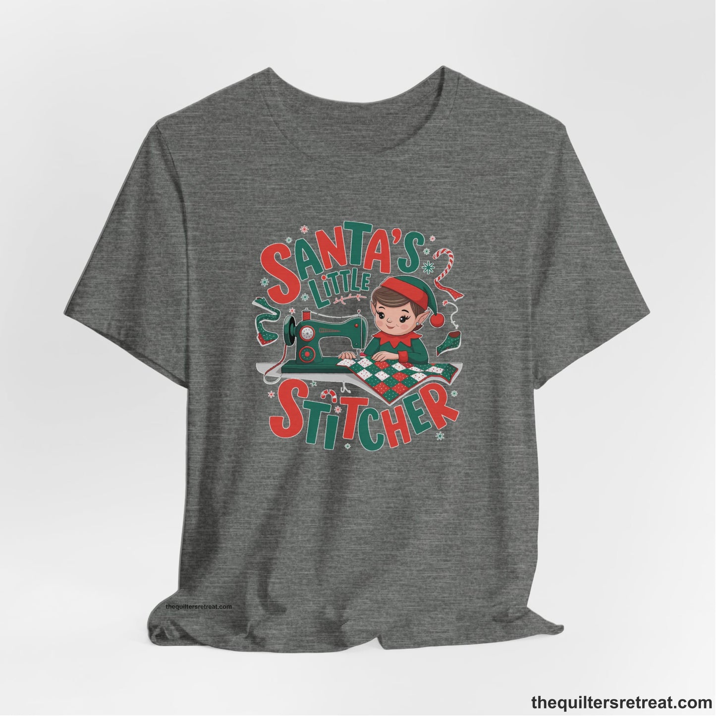 A Deep Heather Short Sleeve T-Shirt with a santa's little stitcher elf sewing quilt with festive colors in playful style