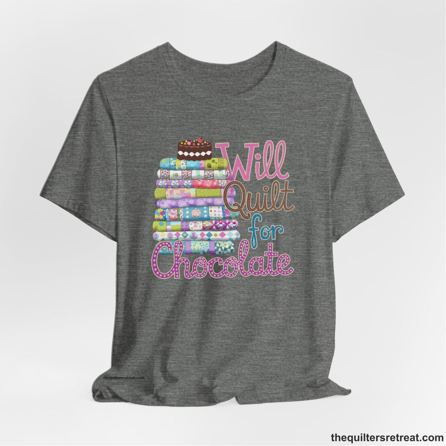 A Deep Heather Short Sleeve T-Shirt with a stack of colorful quilts topped with cake, whimsical "Will Quilt for Chocolate" text