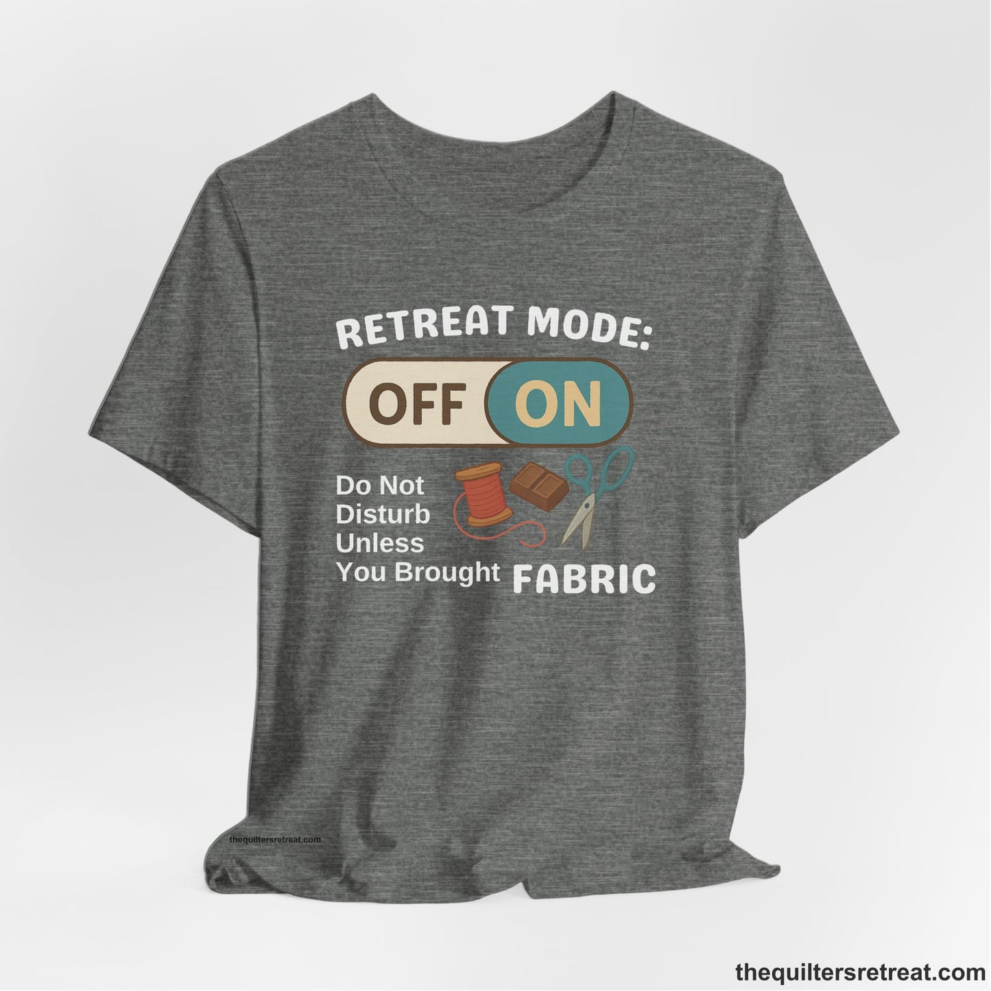A Deep Heather Short Sleeve T-Shirt with a illustration of sewing tools with a playful "OFF ON" switch design