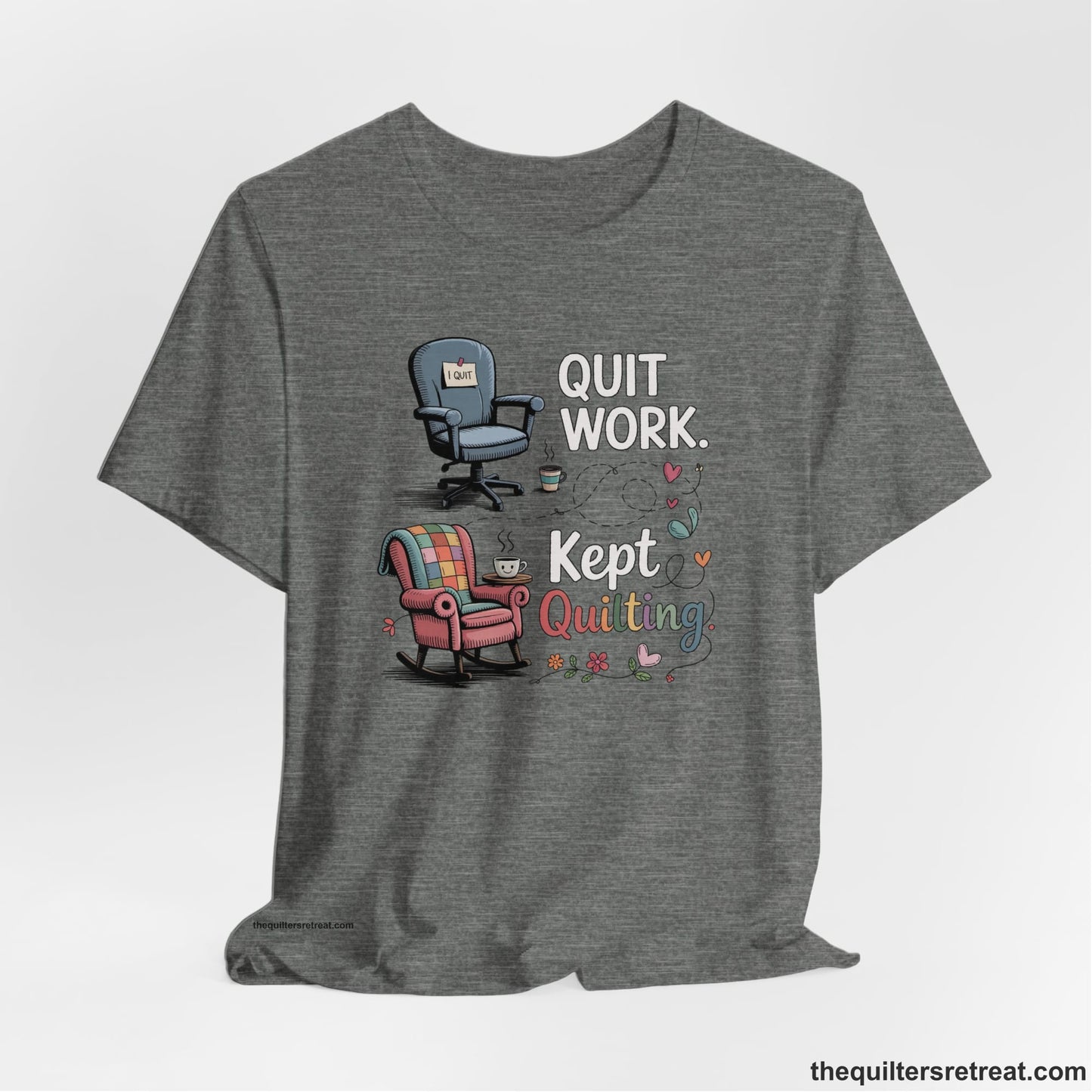 A Deep Heather Short Sleeve T-Shirt with a quit work kept quilting text with cozy chairs and colorful floral accents in a whimsical style