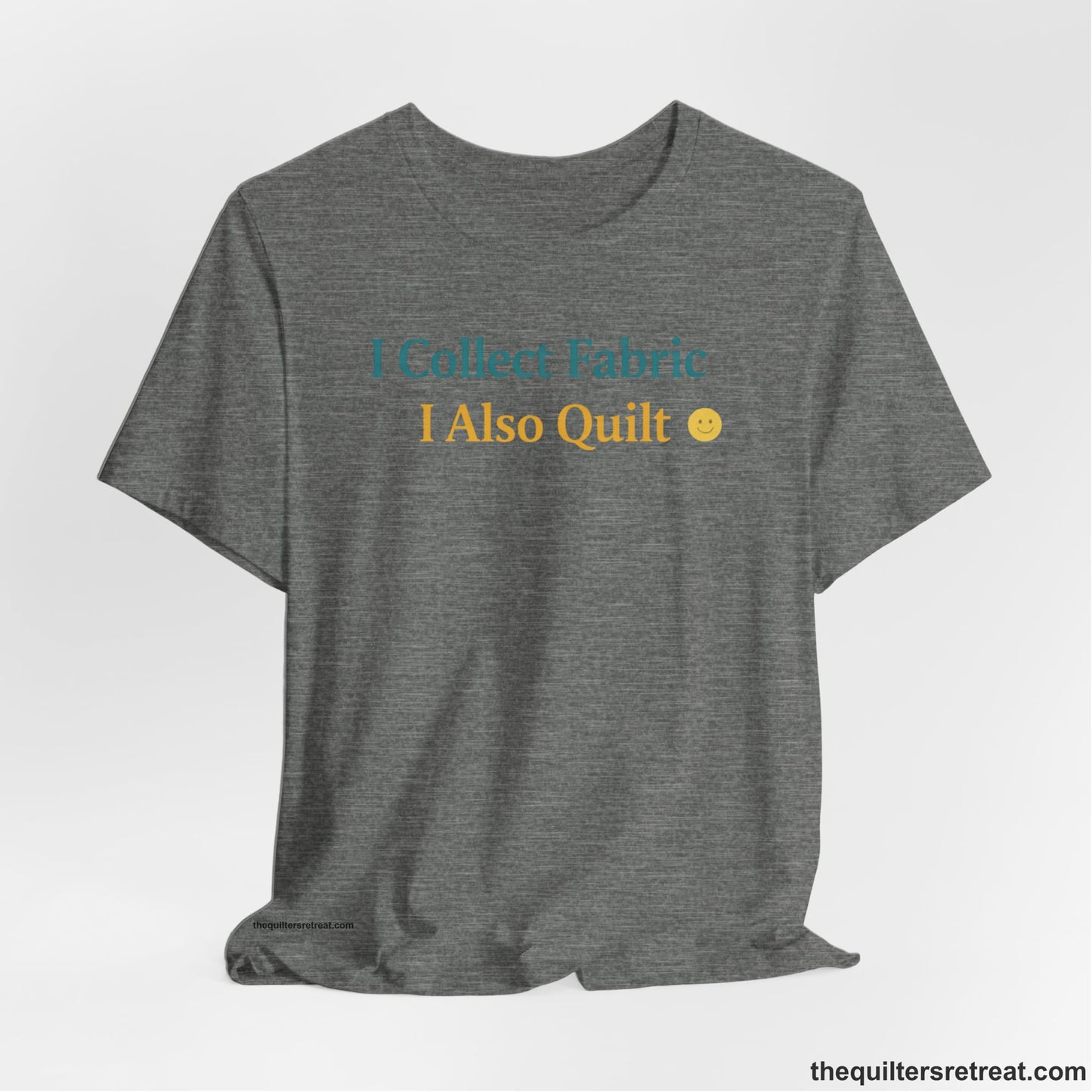 A Deep Heather Short Sleeve T-Shirt with a Colorful text saying "I Collect Fabric I Also Quilt" with a playful, cheerful vibe.