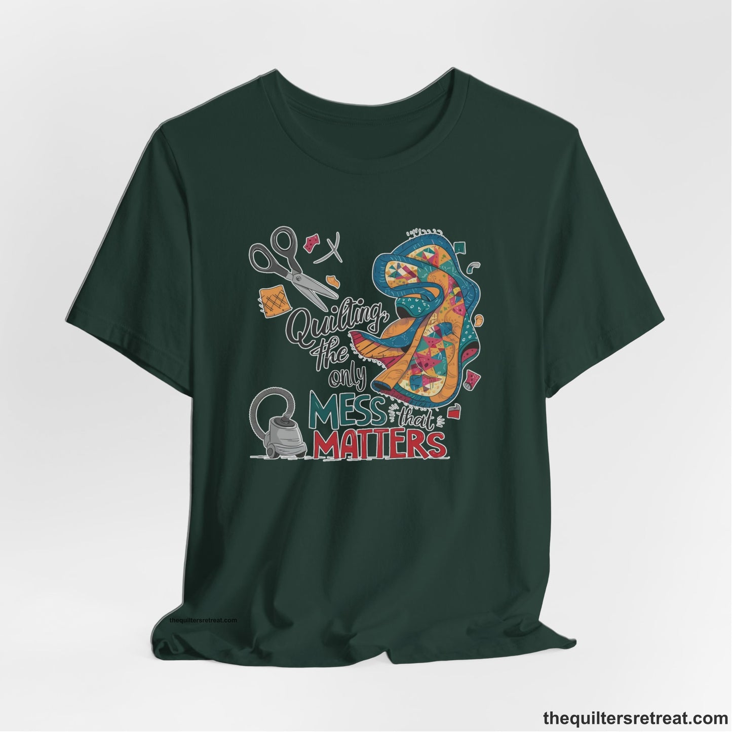A Forest Short Sleeve T-Shirt with a quilting tools and patchwork pieces with bold "Quilting, the only mess that matters" text