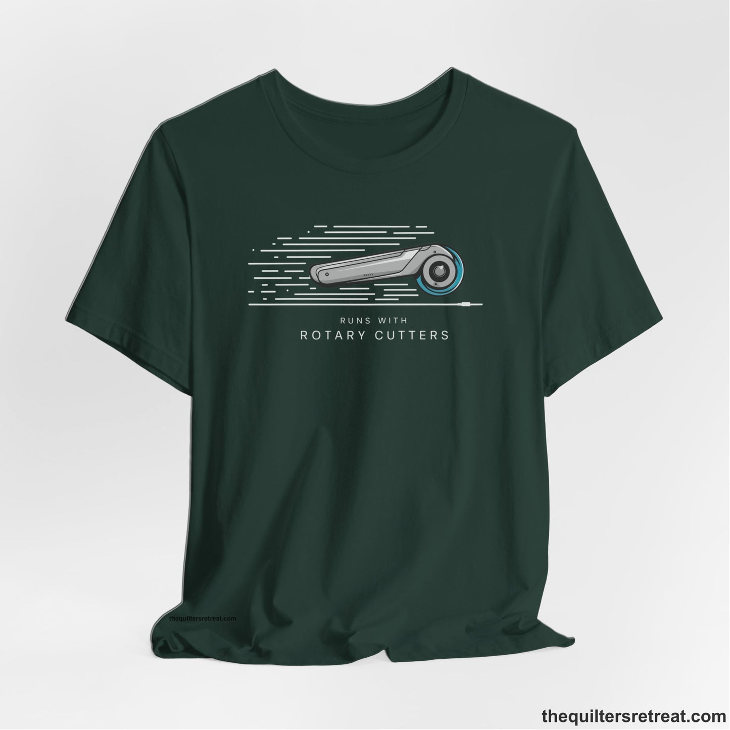 A Forest Short Sleeve T-Shirt with a rotary cutter illustration with dynamic lines and bold "Runs with Rotary Cutters" text