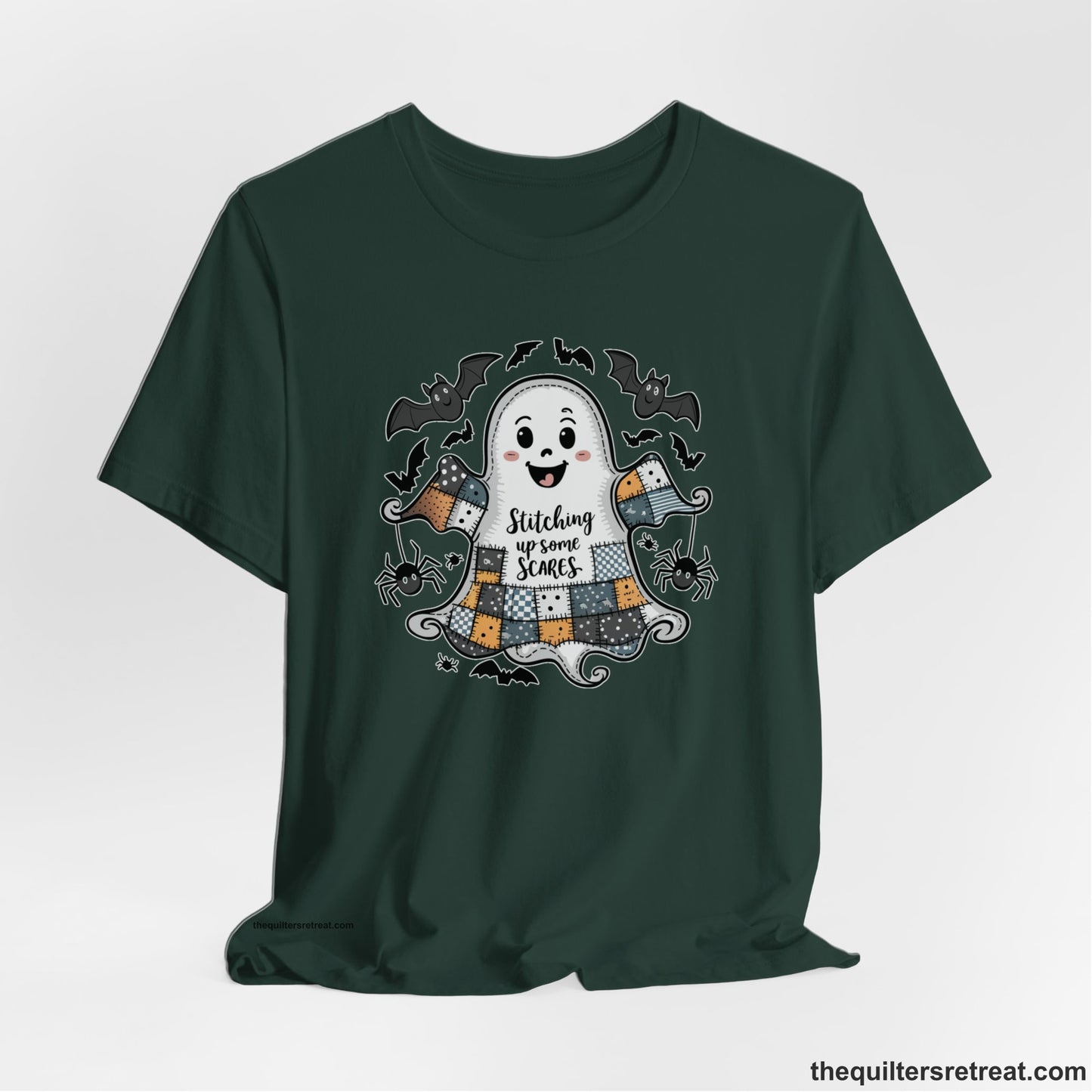 A Forest Short Sleeve T-Shirt with a cute patchwork ghost with "Stitching up some Scares" text and playful bats in a whimsical style