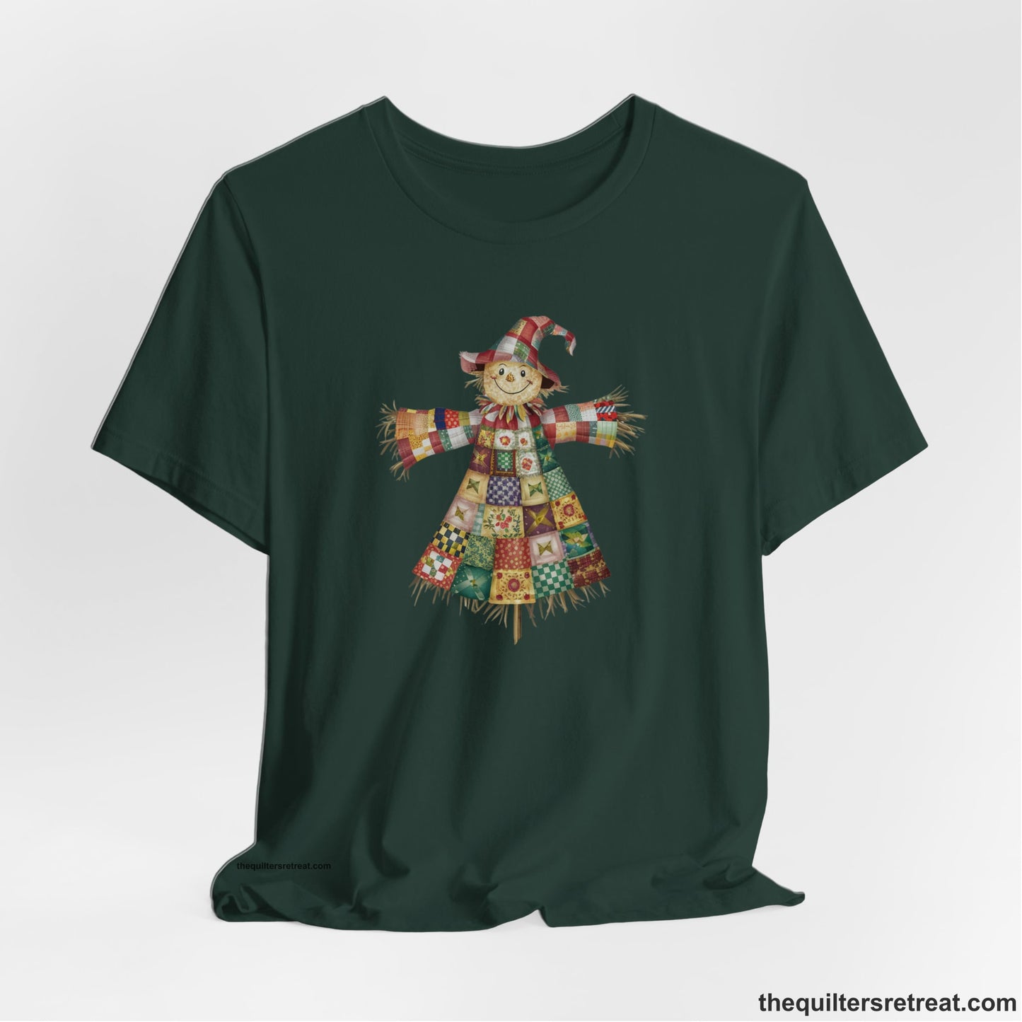A Forest Short Sleeve T-Shirt with a patchwork scarecrow with a cheerful face in a whimsical style