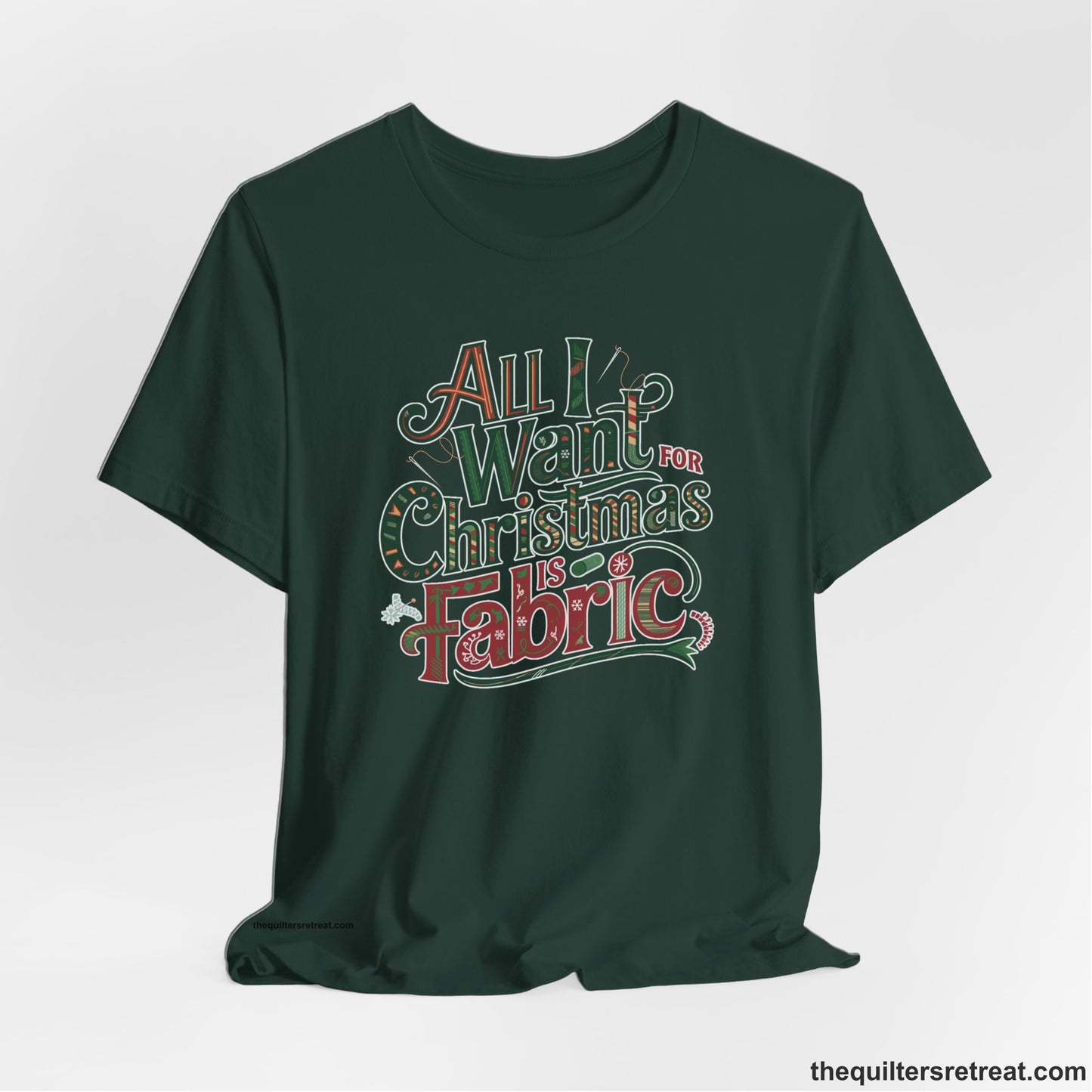 A Forest Short Sleeve T-Shirt with a vintage holiday text "All I Want for Christmas is Fabric" with festive motifs