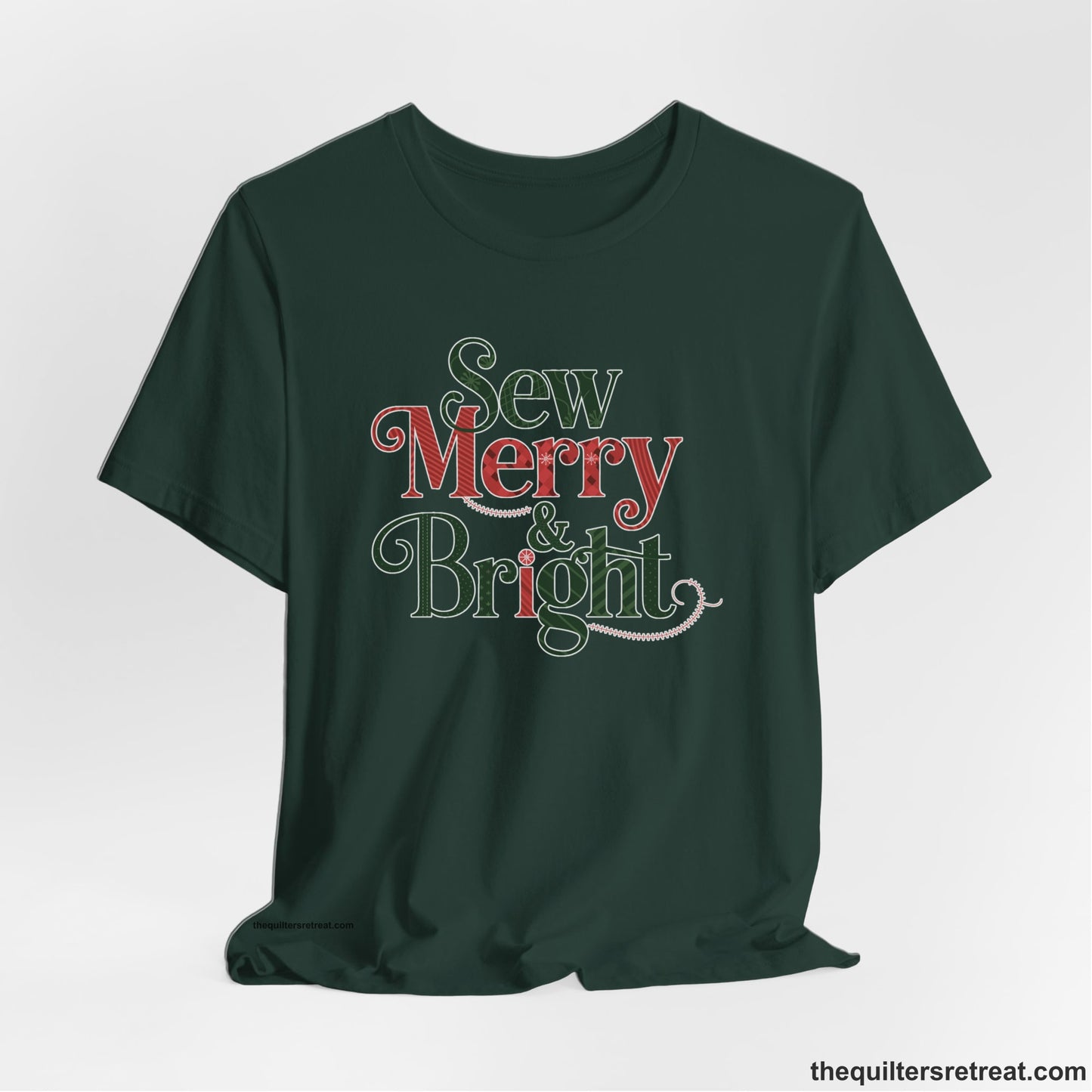 A Forest Short Sleeve T-Shirt with a festive "Sew Merry & Bright" text with decorative holiday patterns