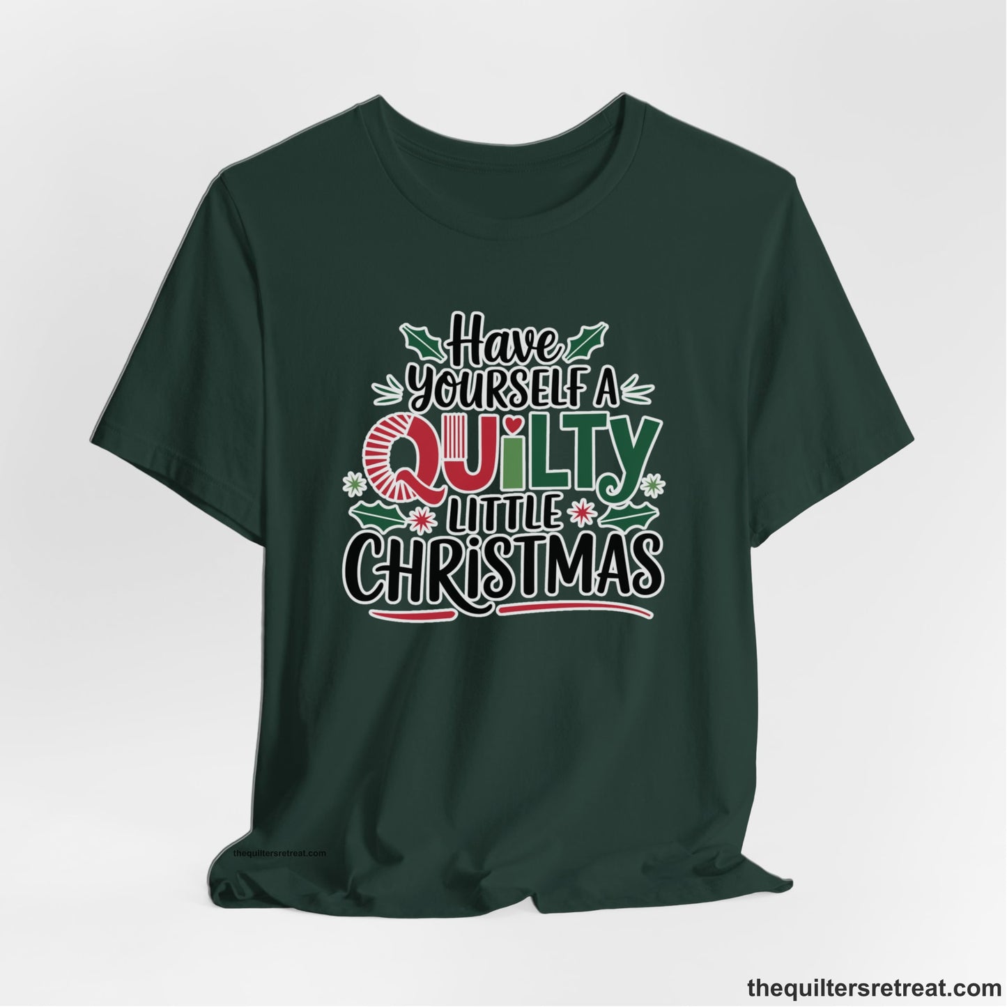 A Forest Short Sleeve T-Shirt with a festive "Have Yourself a Quilty Little Christmas" text with holly and quilt patterns