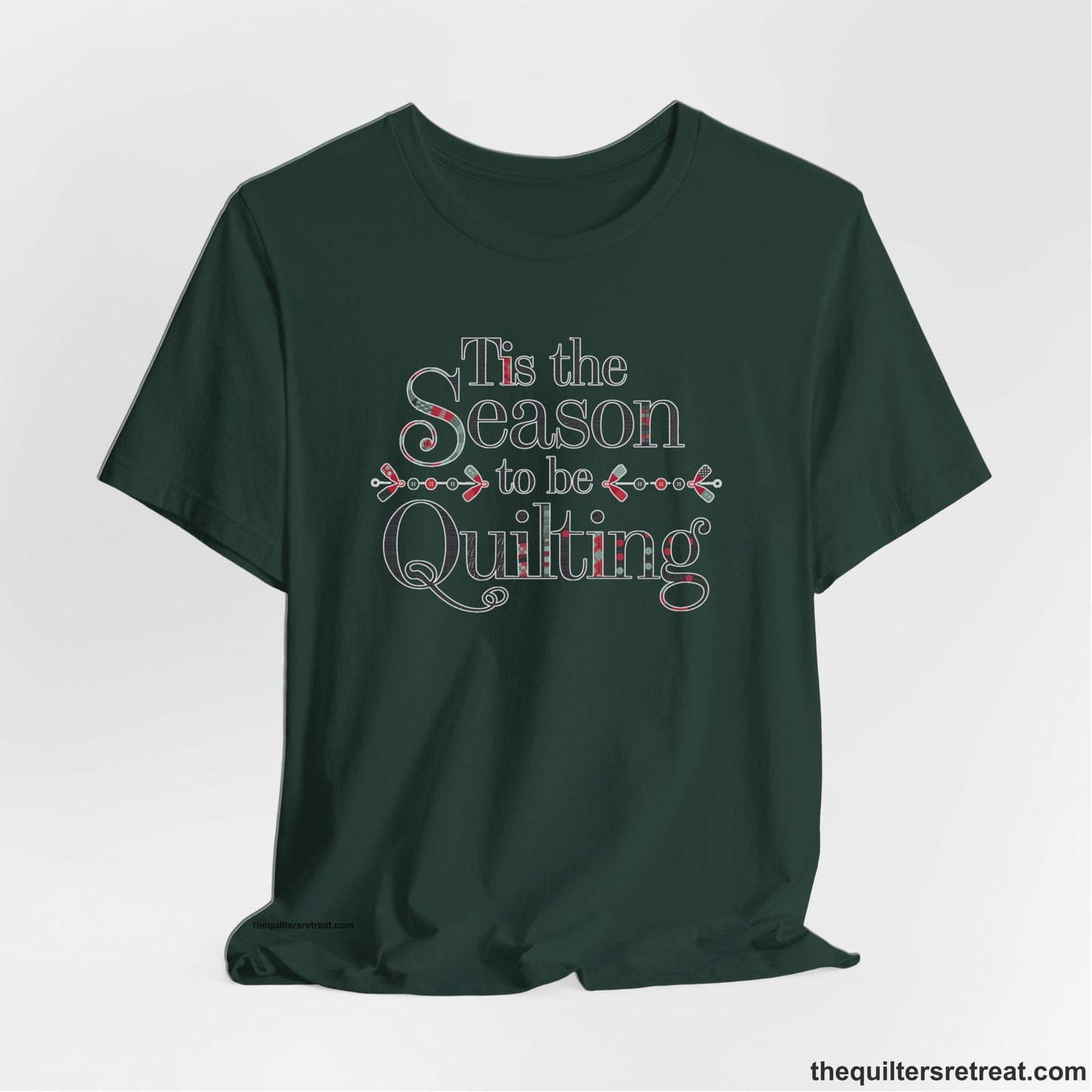 A Forest Short Sleeve T-Shirt with a tis the season to be quilting text with festive patchwork pattern in a cheerful style