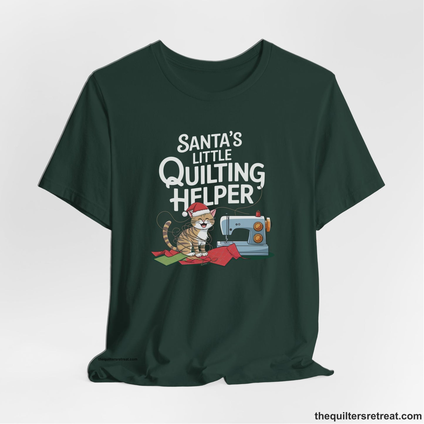 A Forest Short Sleeve T-Shirt with a santa-hat-wearing kitten with a sewing machine and "Santa's Little Quilting Helper" text in playful style