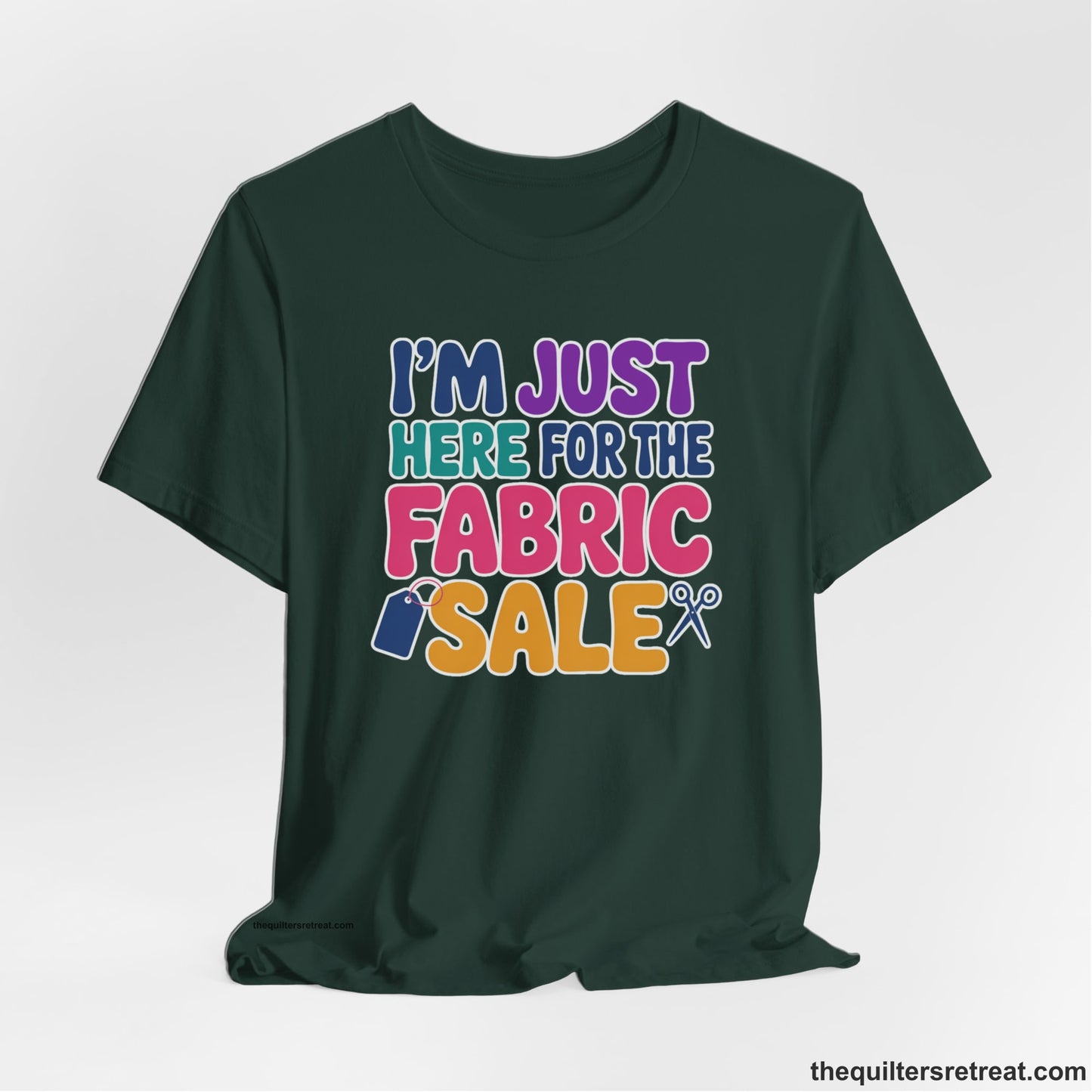A Forest Short Sleeve T-Shirt with a playful "I'm Just Here for the Fabric Sale" text with colorful letters and sewing icons