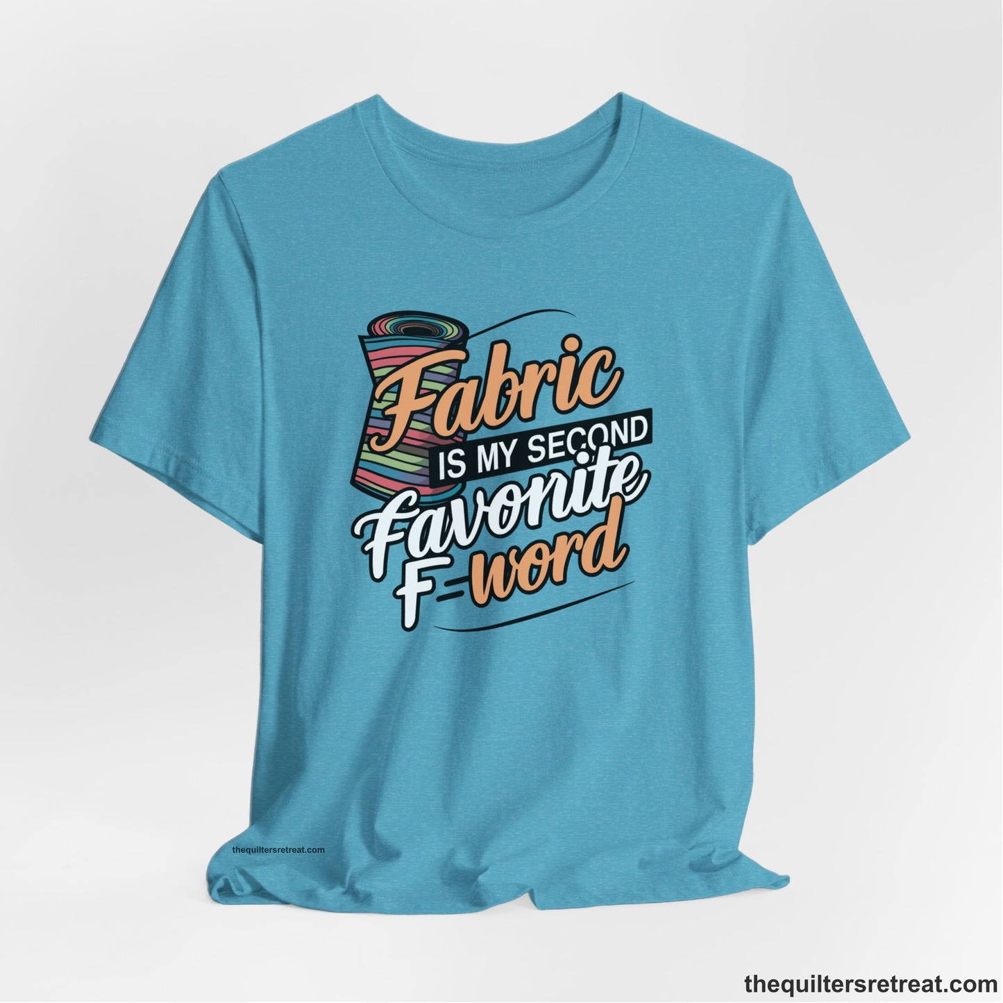 A Heather Aqua Short Sleeve T-Shirt with a fabric bolt illustration with bold "Fabric Is My Second Favorite F Word" text