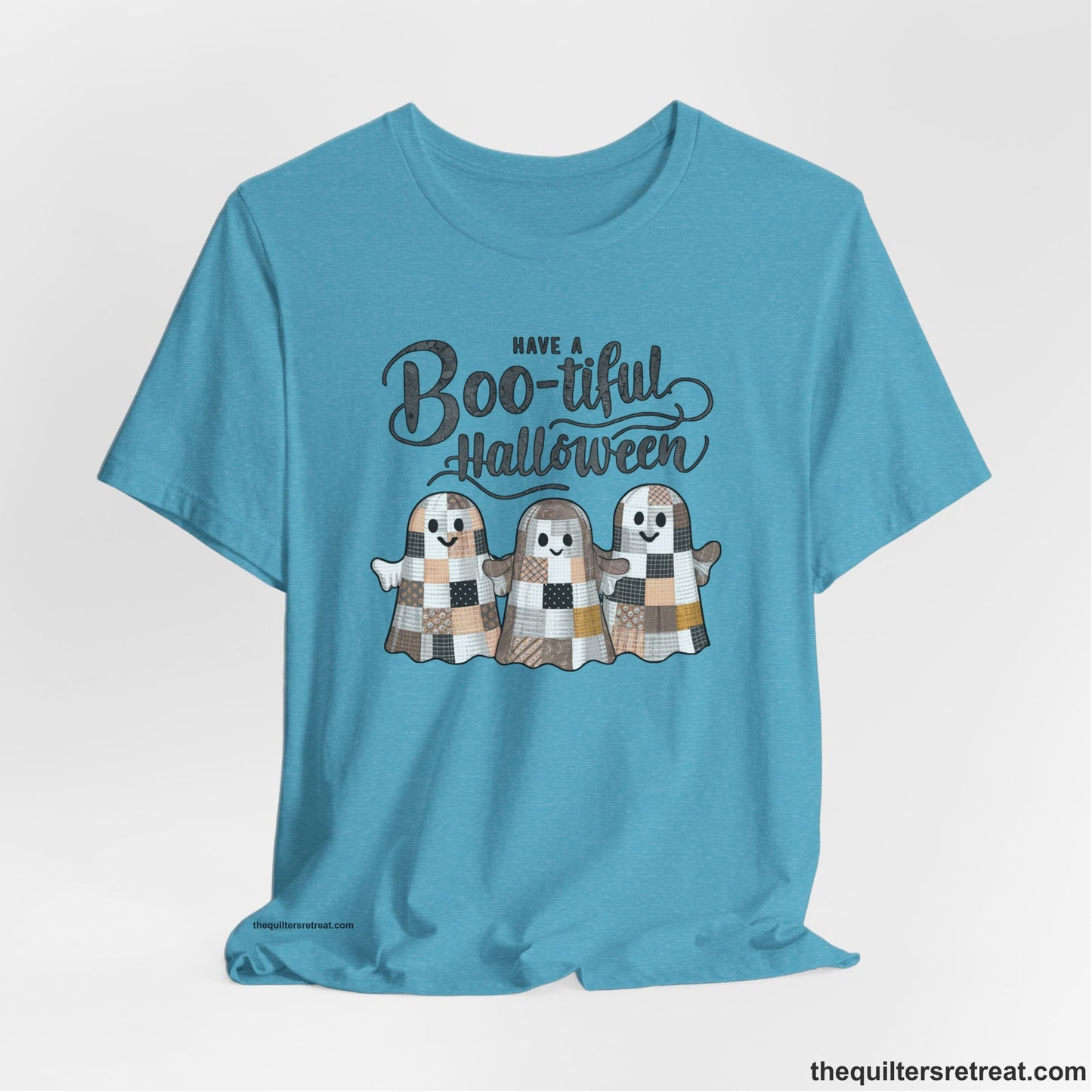 A Heather Aqua Short Sleeve T-Shirt with a cute patchwork ghosts with "Boo-tiful Halloween" text in a playful style