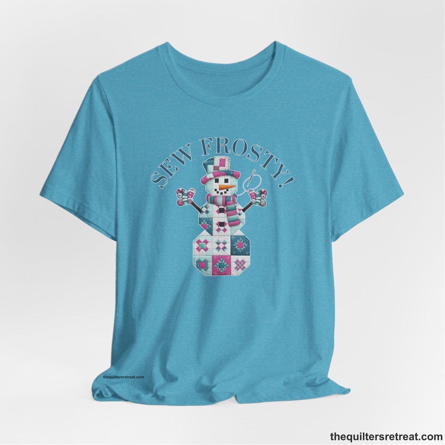 A Heather Aqua Short Sleeve T-Shirt with a snowman quilt pattern with "Sew Frosty!" text in a crafty style