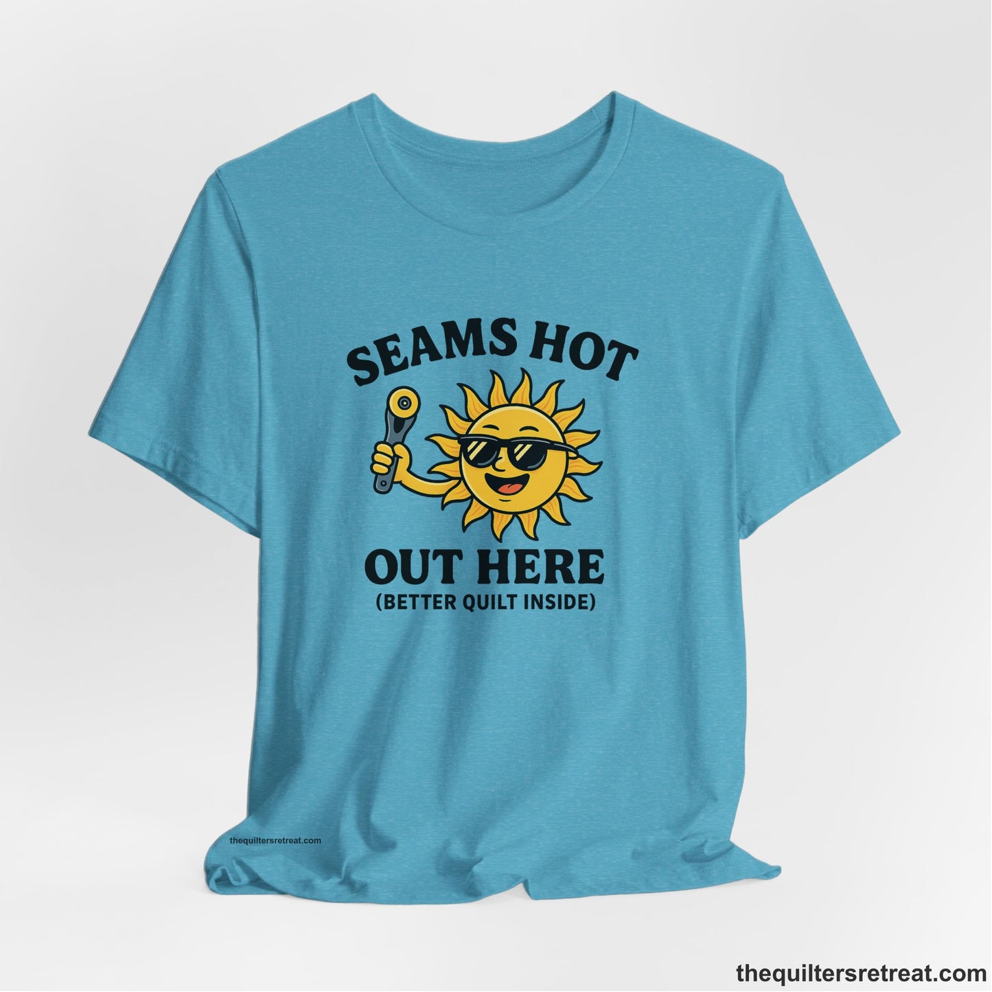 A Heather Aqua Short Sleeve T-Shirt with a smiling sun with sunglasses holding a pizza cutter in a playful cartoon style