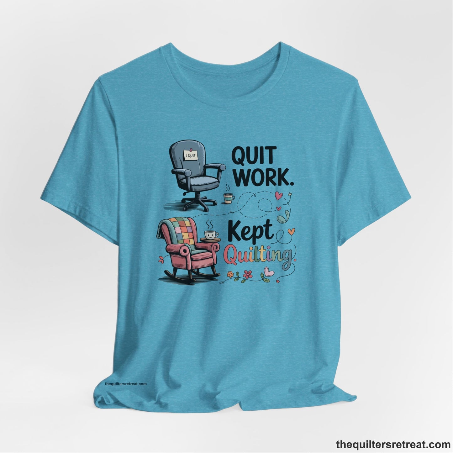 A Heather Aqua Short Sleeve T-Shirt with a quit work kept quilting text with cozy chairs and colorful floral accents in a whimsical style