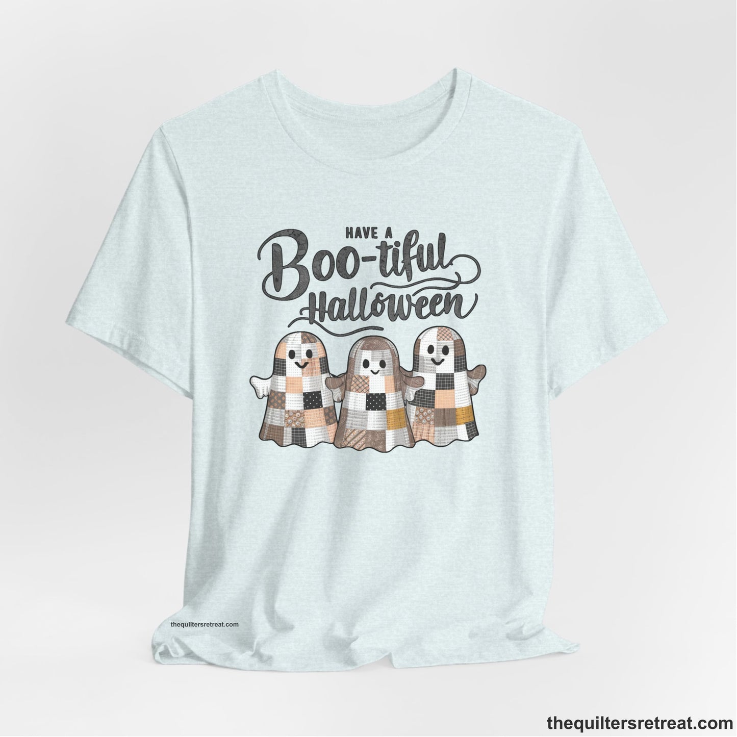 A Heather Ice Blue Short Sleeve T-Shirt with a cute patchwork ghosts with "Boo-tiful Halloween" text in a playful style