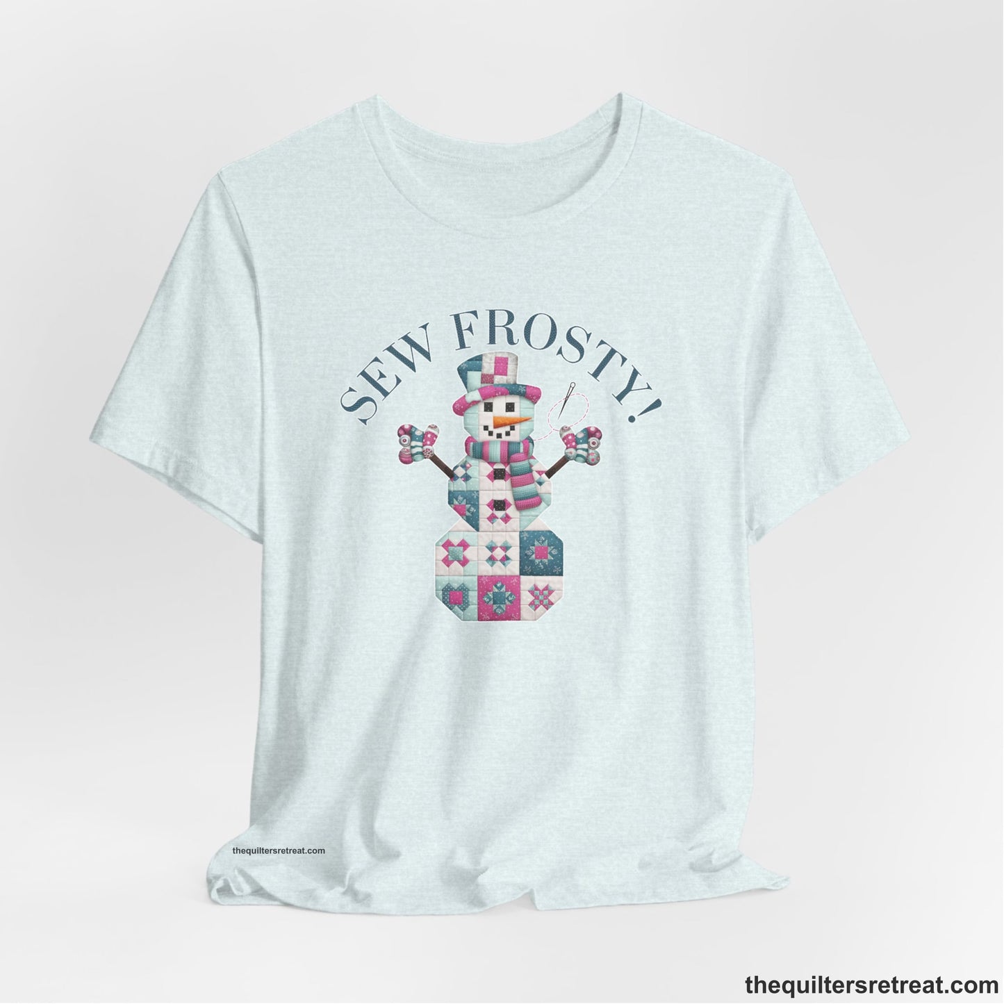 A Heather Ice Blue Short Sleeve T-Shirt with a snowman quilt pattern with "Sew Frosty!" text in a crafty style