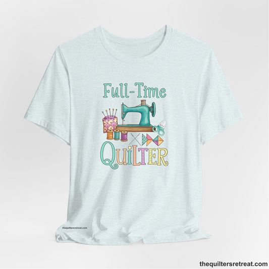 A Heather Ice Blue Short Sleeve T-Shirt with a vintage sewing machine with colorful threads and "Full-Time Quilter" text in playful style