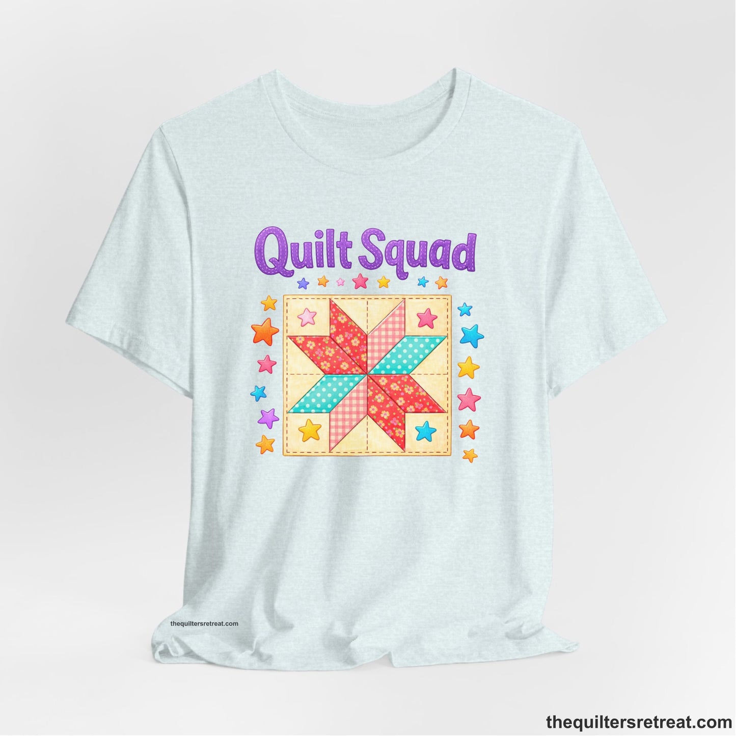 A Heather Ice Blue Short Sleeve T-Shirt with a Patchwork quilt star with colorful stars, playful mood, "Quilt Squad" text.