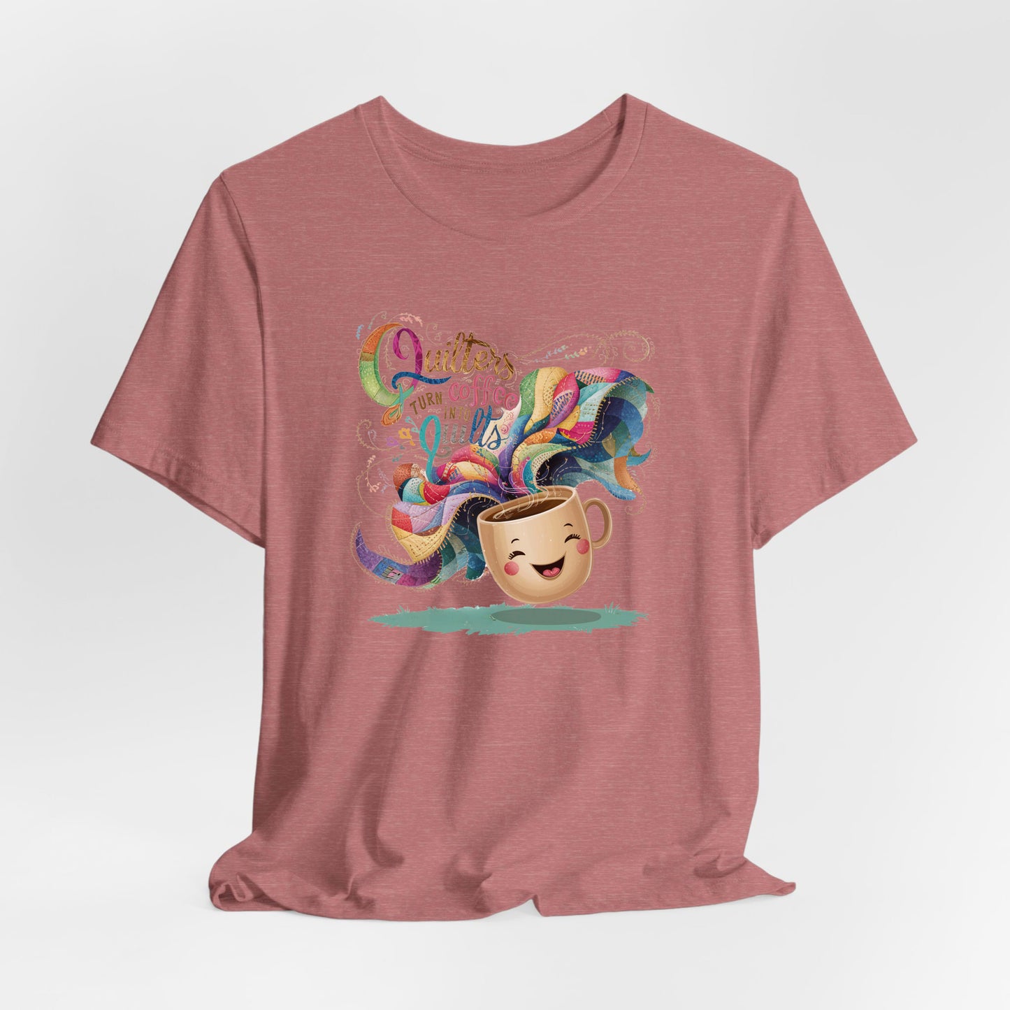 A Heather Mauve Short Sleeve T-Shirt with a quirky "Quilters Turn Coffee into Quilts" text with vibrant swirling patterns