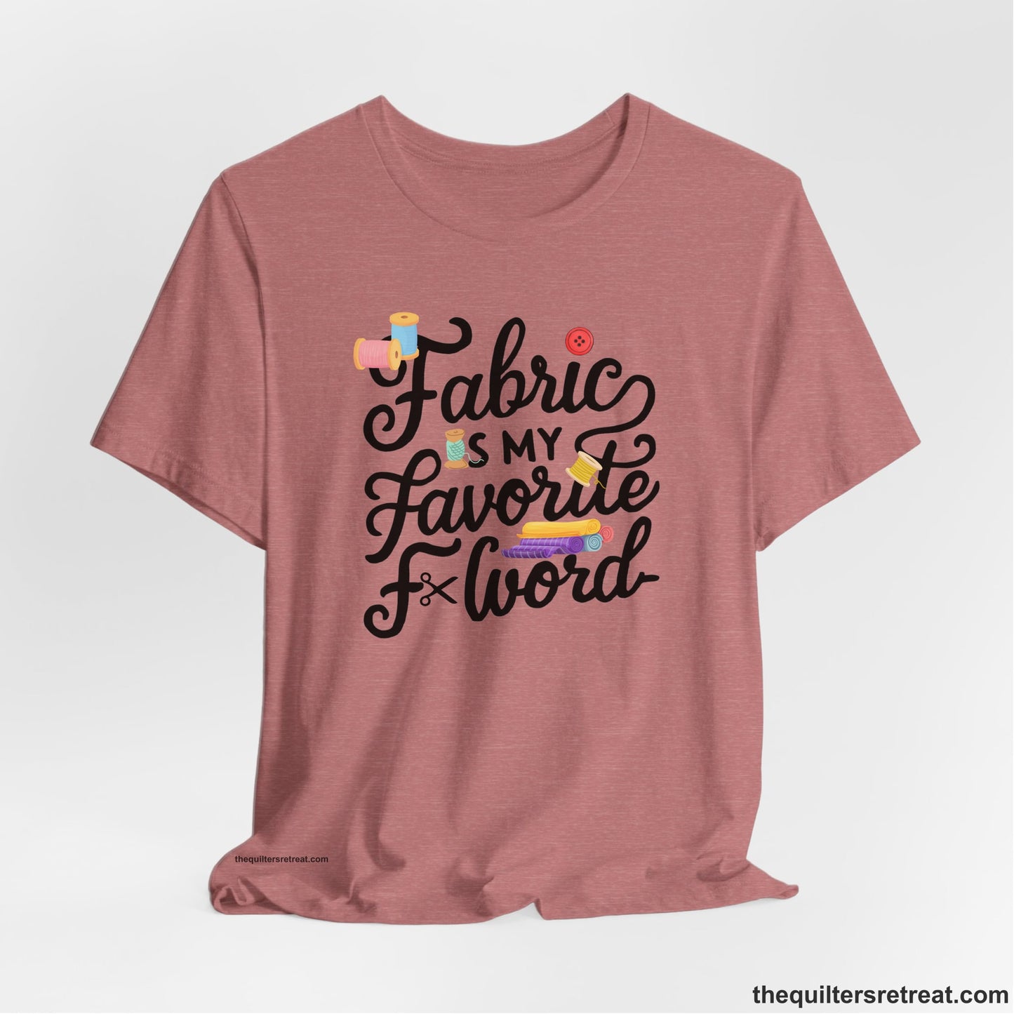 A Heather Mauve Short Sleeve T-Shirt with a fabric is my favorite f word text with colorful spools and buttons in a playful style