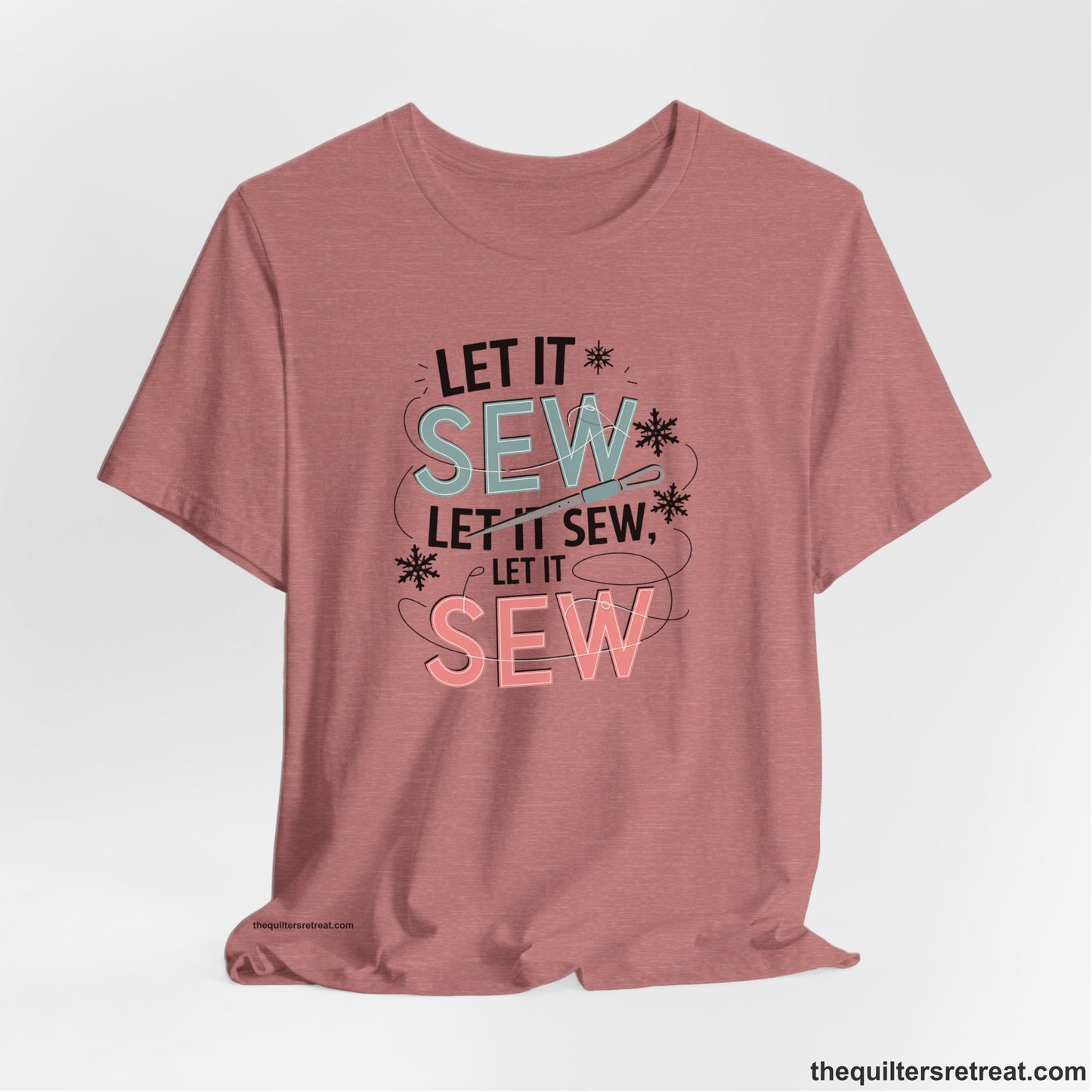 A Heather Mauve Short Sleeve T-Shirt with a bold "SEW" text with needle and thread in a modern style