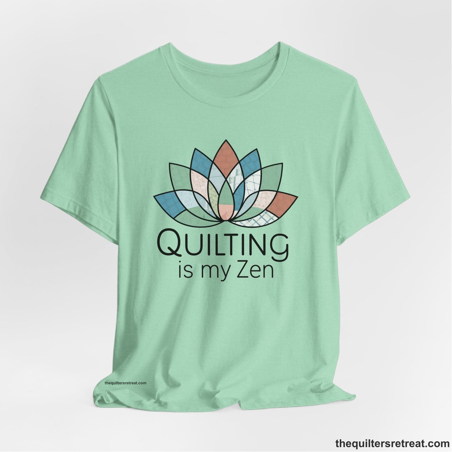 A Heather Mint Short Sleeve T-Shirt with a floral quilt pattern with "Quilting is my Zen" text in a calm, soothing design