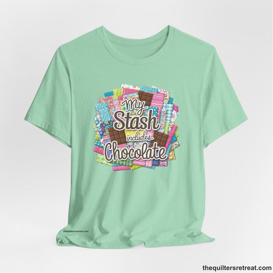 A Heather Mint Short Sleeve T-Shirt with a fabric and chocolate collage with playful "My Stash includes Chocolate" text
