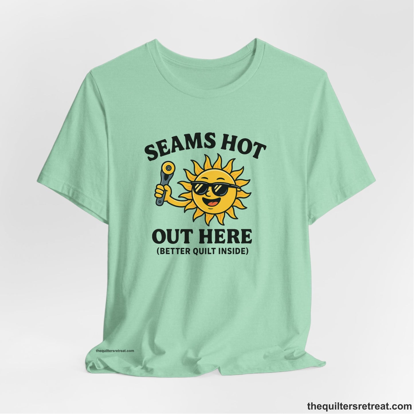 A Heather Mint Short Sleeve T-Shirt with a smiling sun with sunglasses holding a pizza cutter in a playful cartoon style