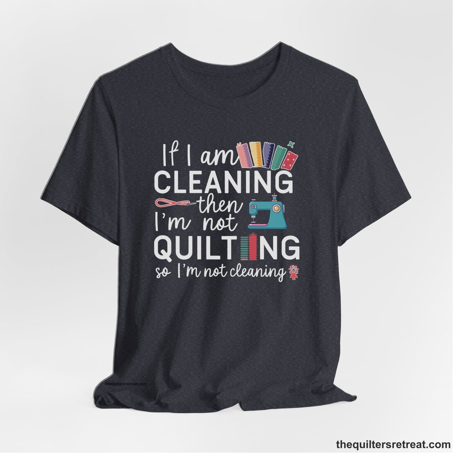 A Heather Navy Short Sleeve T-Shirt with a If I am cleaning then I'm not quilting text with sewing machine and fabric graphics