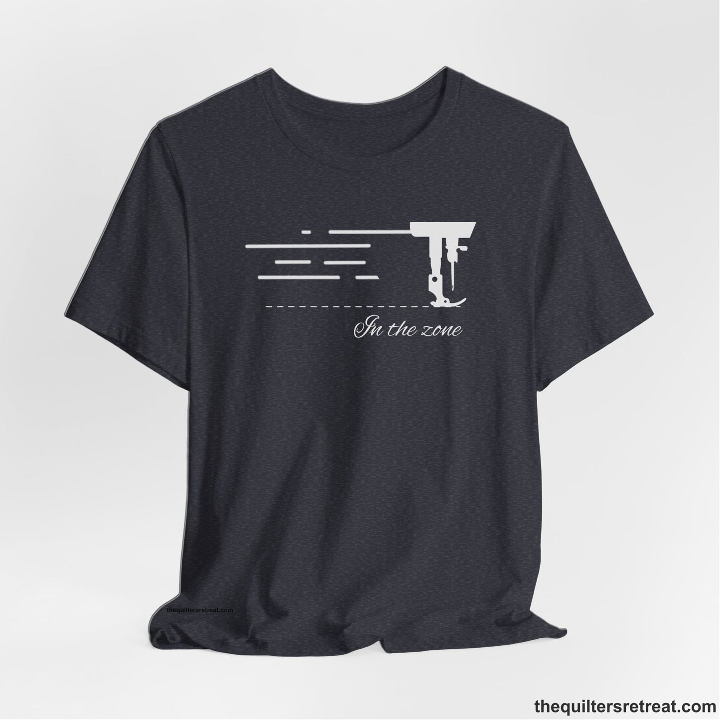 A Heather Navy Short Sleeve T-Shirt with a vintage sewing machine illustration with floral accents and "Sewing Mends the Soul" text