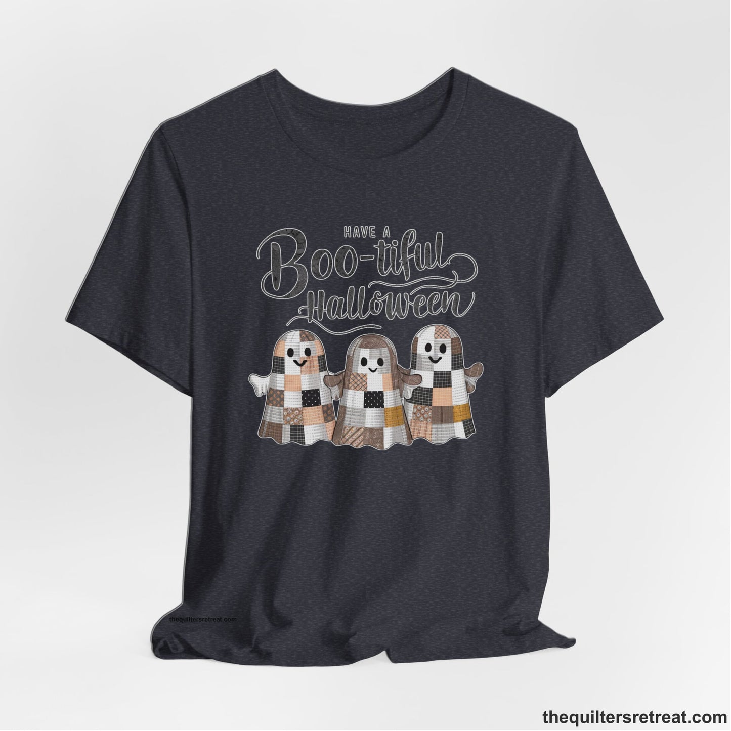 A Heather Navy Short Sleeve T-Shirt with a cute patchwork ghosts with "Boo-tiful Halloween" text in a playful style