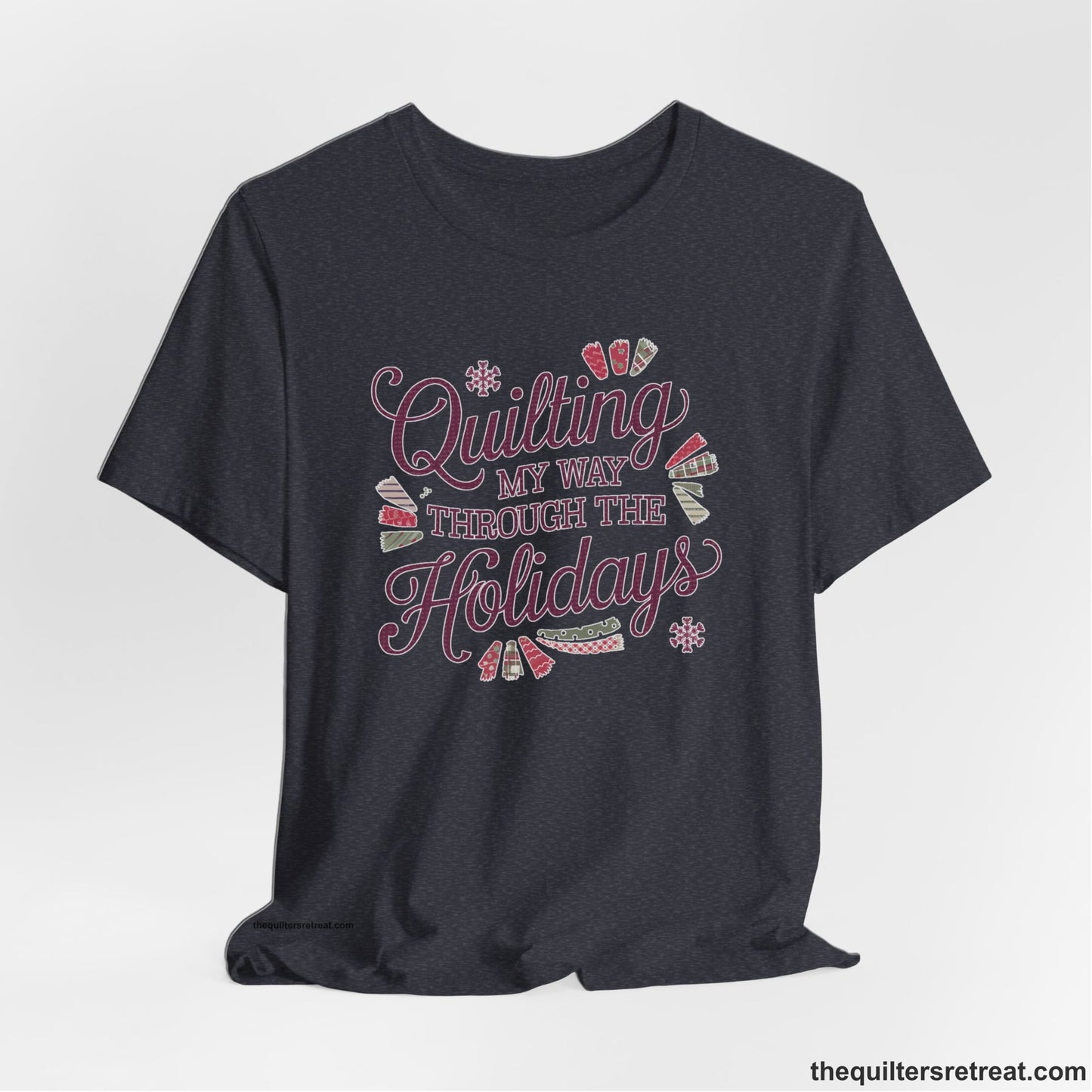 A Heather Navy Short Sleeve T-Shirt with a quilting-themed text in festive colors with decorative quilt patterns