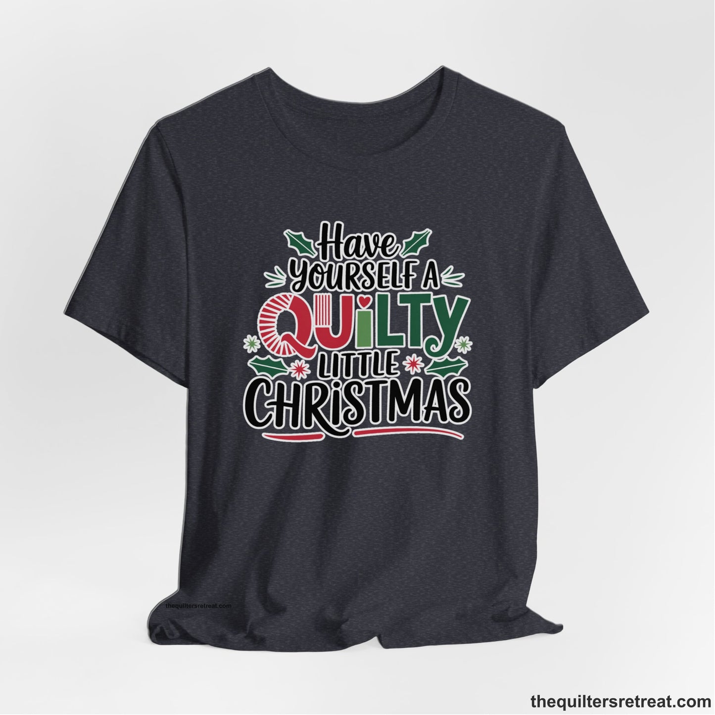 A Heather Navy Short Sleeve T-Shirt with a festive "Have Yourself a Quilty Little Christmas" text with holly and quilt patterns